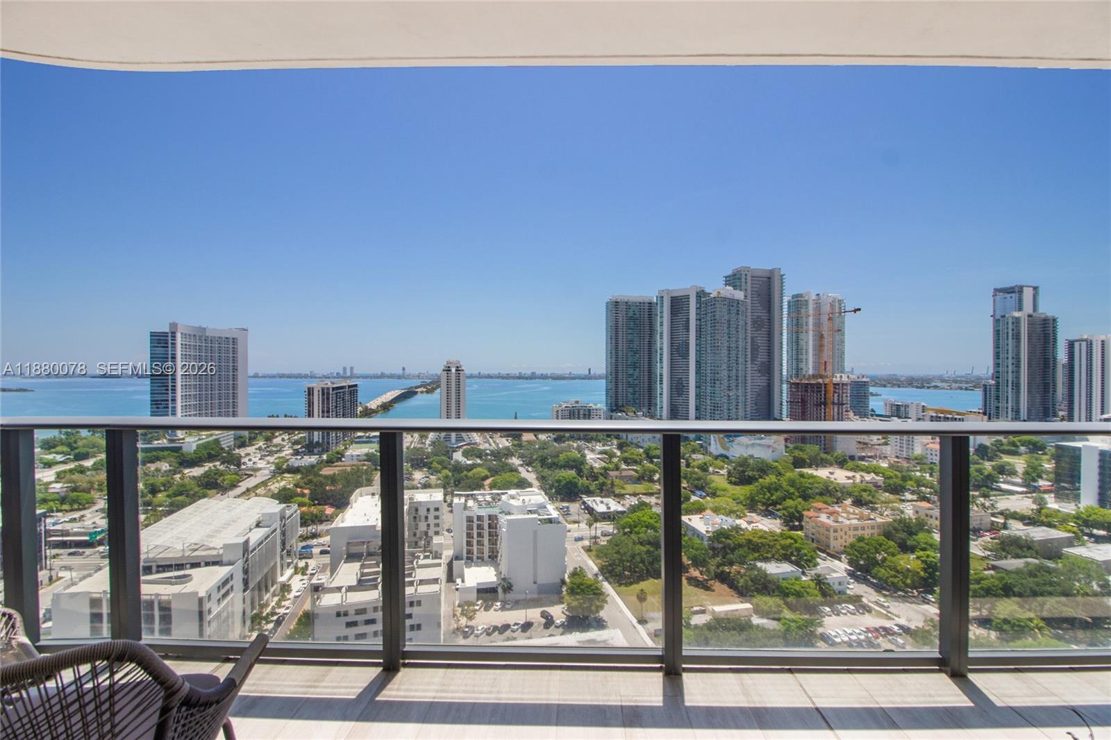 Experience elevated Miami living in this fully renovated corner residence at Hyde Midtown. This meticulously reimagined residence at Hyde Midtown offers an unparalleled turn-key lifestyle. Framed by floor-to-ceiling glass and sweeping waterfront vistas, the home seamlessly blends a design-forward aesthetic with everyday functionality. A chef-inspired custom kitchen anchors the sophisticated living spaces, while the expansive terrace invites effortless outdoor entertaining. Each of the three bedrooms serves as a private sanctuary with its own en-suite bath. Complete with private storage and two deeded parking spaces, this high-style haven puts Miami’s top dining, shopping, and culture right at your doorstep.