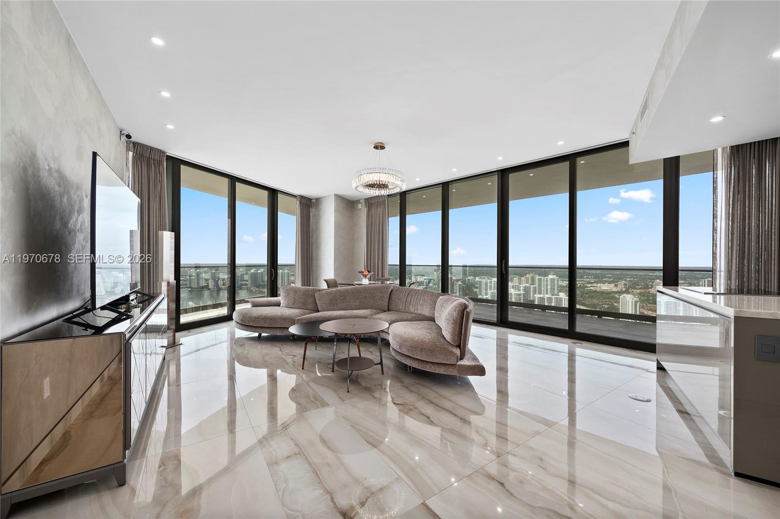 Significant price improvement! Experience elevated oceanfront living in this turnkey 45th-floor corner residence at the prestigious Armani Residences. This 2 bed. 2 bath. residence offers breathtaking panoramic views of the Atlantic Ocean, Intracoastal and city skyline through dramatic floor to ceiling windows. As a coveted corner unit, it features exceptional natural light and a rare vantage point high above South Florida. Thoughtfully designed, the residence includes rectified Italian porcelain flooring throughout, faux-painted accent walls, custom-built closets, automated window sheers and a smart home system. The modern Italian Armani/Casa kitchen features marble countertops, premium cabinetry, and Sub-Zero/ Wolf appliances. Marble appointed bathrooms complete the sophisticated interiors. Perfect for entertaining, the home showcases an expansive 1,000-square-foot wraparound terrace with a summer kitchen and spectacular views. Offered fully furnished with luxury pieces by Artefacto, this exceptional residence is move-in ready in one of South Florida’s most iconic addresses. Enjoy five star amenities including a private oceanfront restaurant and bar, luxurious Armani Spa, private movie theater, heated pool, two hot tubs, cigar lounge, children’s playroom, billiards, card room and a state-of-the-art fitness center.