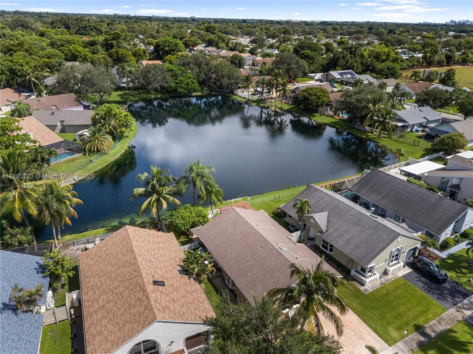 Gorgeous lakefront 3BD/2BA + 1-car garage in Cooper City—Walk to top A-rated schools! Home features vaulted ceilings, crown molding, open eat-in kitchen with bar, granite tops & antique wood cabinets, formal dining, whirlpool tub, split floor plan, accordion shutters, brand new A/C.  Lake views from master & living room. Relax on the breezy sunny lakefront orchid patio!  Welcoming safe community.  Short trip to Cooper City Pool-Tennis-Gym Center, parks, University Drive shopping & so much more...Year 2005 Roof..