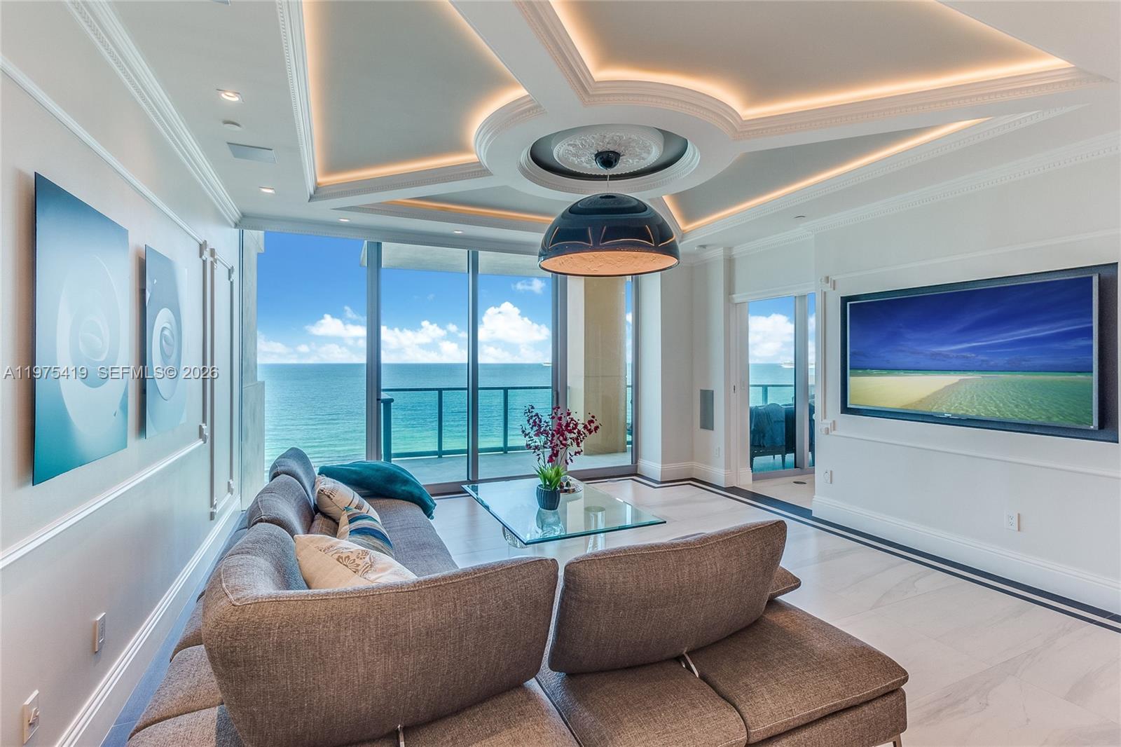 Direct ocean views welcome you the moment you step off your private elevator into this exceptional Lower Penthouse at Il Villaggio. Featuring 10’ ceilings and a coveted flow-through layout, this residence captures breathtaking, unobstructed views of the Atlantic Ocean to the east and vibrant city sunsets to the west. Expansive terraces create seamless indoor-outdoor living and an elevated oceanfront experience.

The open chef’s kitchen, accented with elegant designer lighting, flows effortlessly into the living and dining areas, ideal for refined entertaining or everyday luxury. The residence is fully integrated with a Control4 smart home system, allowing centralized control of lighting, climate, audio, and more throughout the entire home.

Bedrooms are thoughtfully arranged in a split floor plan for privacy, each with its own en-suite bath and private balcony. Each bathroom features a Toto Washlet® smart toilet with integrated bidet functionality, heated seat, warm water cleansing, and customizable comfort settings.

Il Villaggio is a true gated, full-service luxury condominium with 24-hour security, concierge, and exceptional staff. The building has recently completed concrete restoration and fully remodeled amenities, now presented brand new. Residence includes a private electric charging station. Owner occupied. 24-hour notice required. Schedule your private showing today and experience the very best of South Beach oceanfront living.
