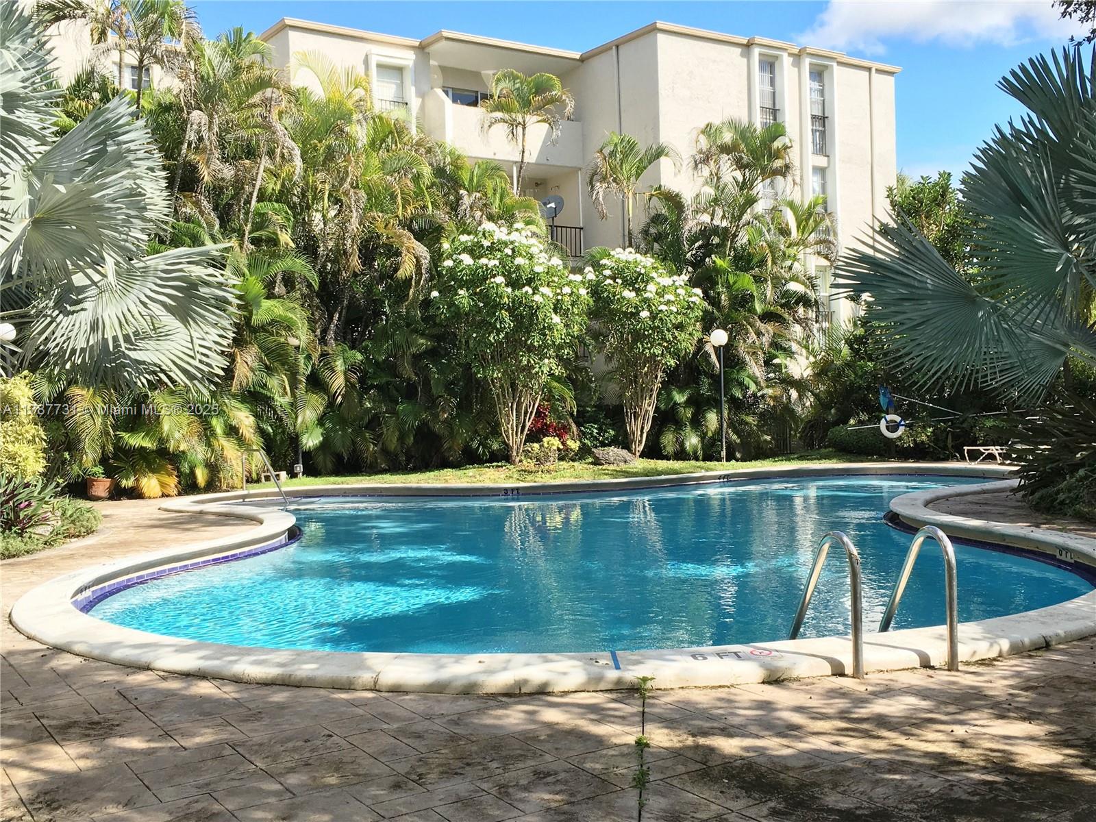 Lovely loft style apartment with views of lush garden and pool. Plenty of natural light and open space. Hurricane impact windows. Enjoy a living area with a 20 ft vaulted ceiling. Bedroom located upstairs. Tile floors throughout, with wood laminate on stairs and in bedroom. Comfortable size and quiet community with security gated entrance. Conveniently located near Dadeland Mall, Metrorail, Gulliver Prep School, and Trader Joes. Access US1 and 878 Expressway. Laundry facilities in building. Available for occupancy June 12, 2025. Shared laundry rooms in building (no washer/dryer in unit).