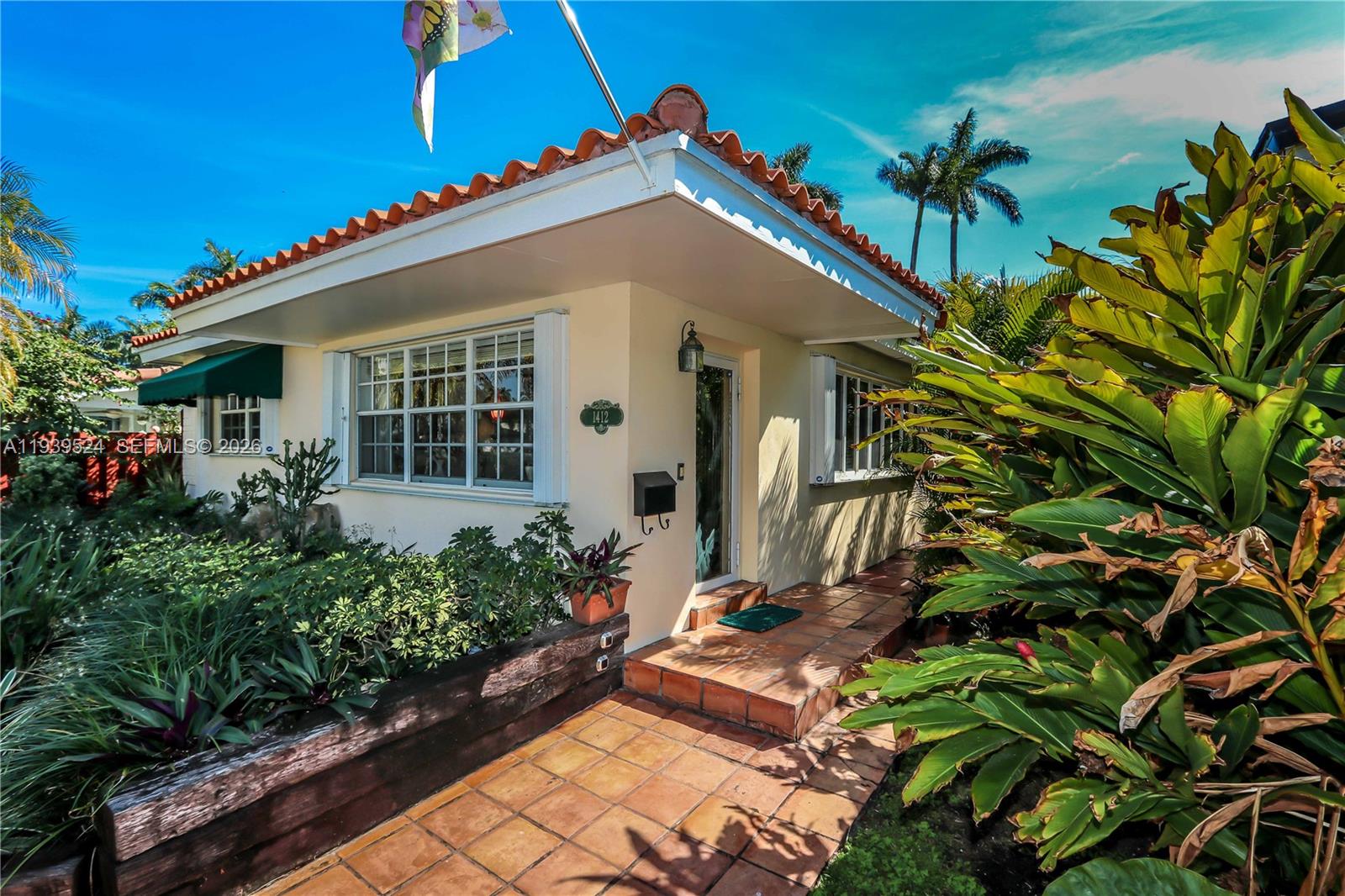 Welcome to this bright and inviting home, just minutes from Hollywood Beach and Downtown! Featuring bamboo floors throughout, crown molding, and custom remote window treatments, this home exudes warmth and style. The chef’s kitchen boasts wood cabinetry, granite counters & backsplash, a gas cooktop, and new appliances. Enjoy meals in the formal dining room, then relax in the oversized Florida room, which opens to a composite patio with a built-in Jacuzzi and BBQ. The primary suite features French doors to the patio, a huge walk-in closet, and an elegant bath with a stained-glass window. Additional highlights include a 2.5-car covered carport, accordion shutters, an alarm system, a 2024 A/C, and a newer water heater (2022).