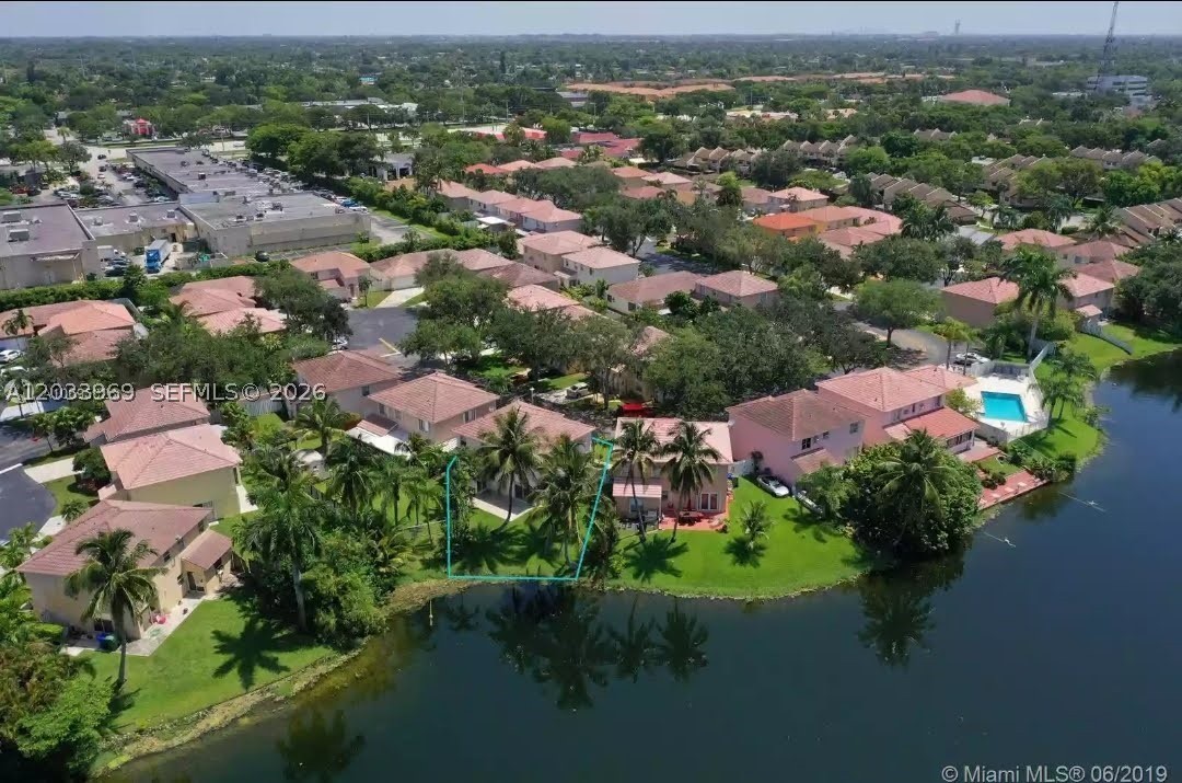 Imagine waking up every morning to peaceful lake views, soft natural light, and the feeling of being on vacation without leaving home. Welcome to 320 SW 99 Ave in Pembroke Pines, FL. a beautiful lakefront residence designed for buyers who want comfort, warmth, and the South Florida lifestyle. From the moment you enter, the home feels bright, open, and inviting. Large windows and sliding doors connect the interior spaces to the water views, creating a relaxing flow between indoor and outdoor living. The updated kitchen features modern finishes, stainless steel appliances, sleek countertops, and an open layout perfect for family mornings, casual dinners, or entertaining friends. NEW ROOF and shutters trough out the home.
The backyard is the true heart of the home. With a private patio, green lawn, palm trees, and direct lake views, it offers the perfect setting for coffee at sunrise, weekend gatherings, or quiet evenings by the water. Spacious bedrooms and flexible living areas provide room for family, guests, work-from-home needs, or growing into your next chapter.Located in desirable Pembroke Pines, close to schools, parks, shopping, dining, and major highways, this home offers both lifestyle and convenience. For buyers searching for a Lake Front home in Pembroke Pines. with charm, comfort, and an emotional connection to nature, 320 SW 99 Ave is ready to welcome you home.