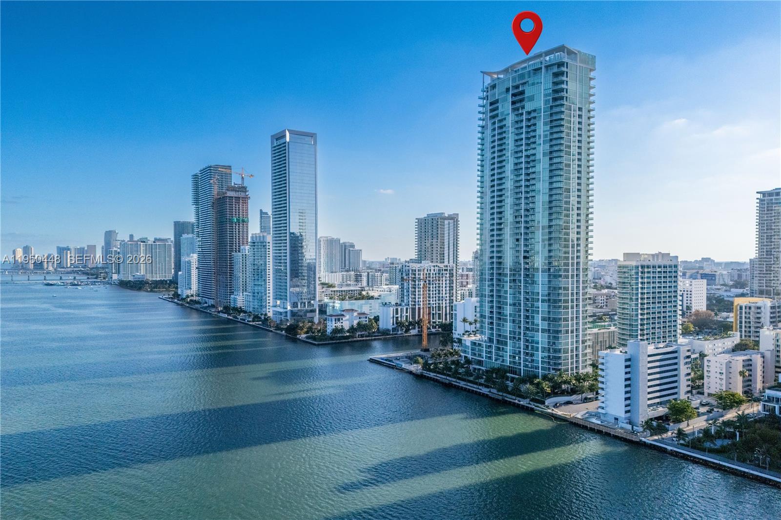 Corner Unit with Endless Views! Spacious 1BD + den, 2BA on the 40th floor with stunning views of Biscayne Bay and Miami skyline. Features private elevator and foyer, marble floors, anti-slip marble balcony, custom closets, blackout drapes in bedroom, and sheer vanilla curtains in living room. Floor-to-ceiling 10’ windows bring in natural light. High-end Miele appliances, washer/dryer, and premium finishes. Large balcony accessible from living and bedroom. Enjoy top amenities: beach club, 2 pools, man-made beach, tennis, volleyball, gym, spa, dog park, business center, and more!