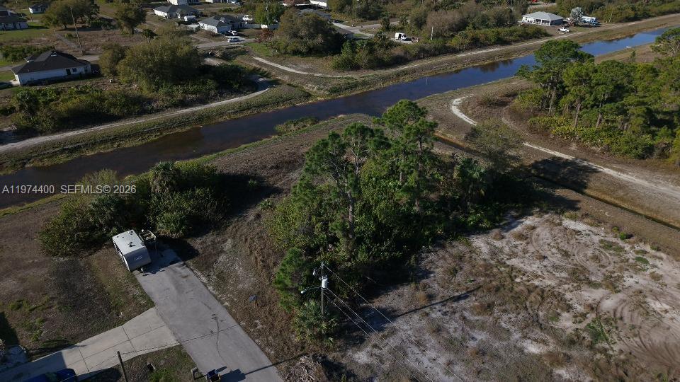 Beautiful vacant lot in fast-growing Lehigh Acres with canal views at both the rear and the side, offering rare privacy and serene water vistas. Located on a quiet dead-end road and just minutes from River Hall Country Club & Golf, with convenient access to Fort Myers at just 18 miles and 22 miles to LaBelle. This is an ideal setting to build your dream home in a rapidly developing area surrounded by new construction and Florida’s natural beauty.