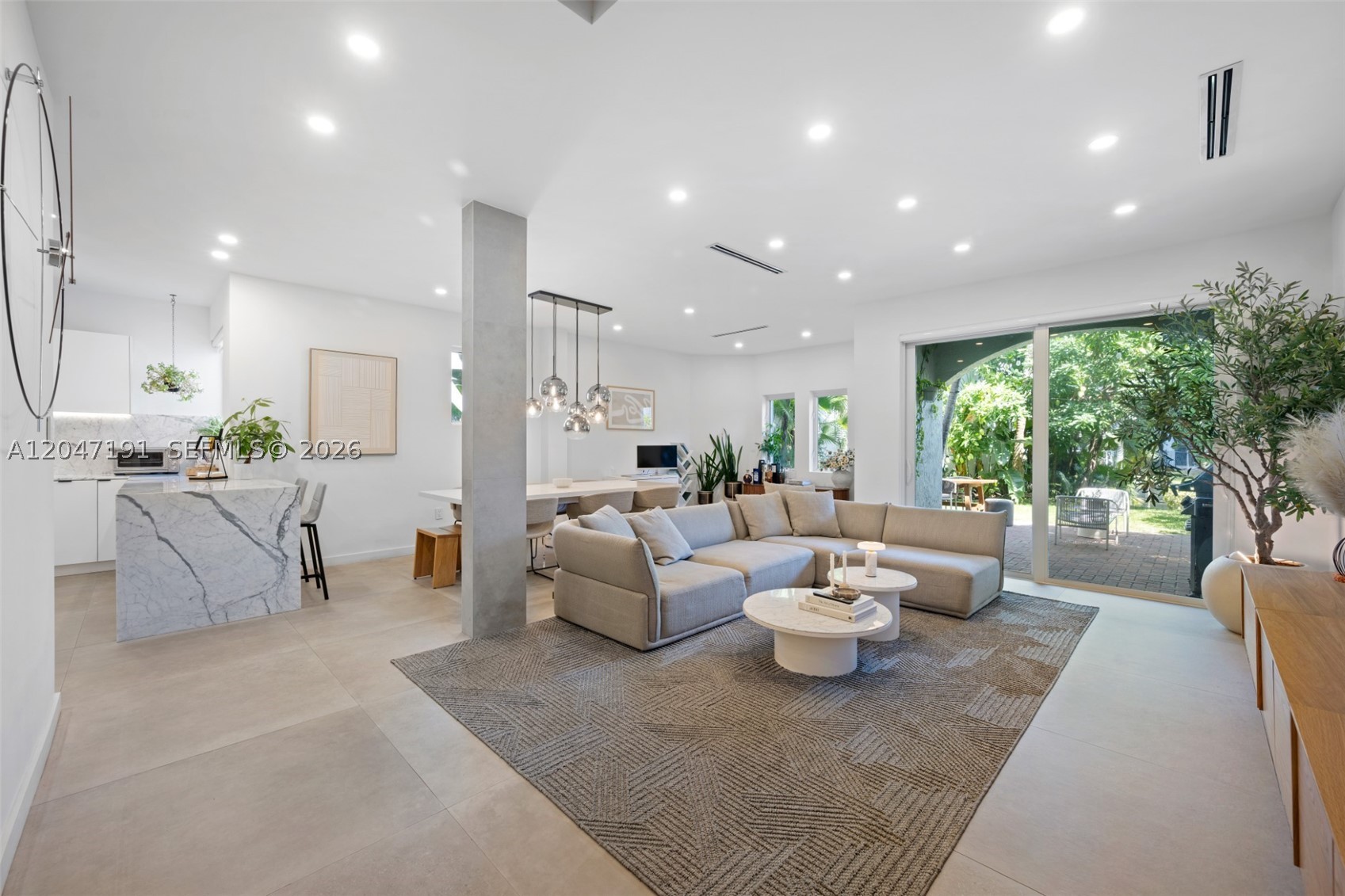 This exceptional 3-bedroom, 2.5-bath waterfront home in Aventura Lakes blends modern elegance with timeless design, featuring striking 40" x 40" porcelain tile, natural white oak wood and glass flooring accents, soaring 9-foot ceilings, and a dramatic floating staircase. The chef's kitchen is appointed with luxurious white quartz marble countertops, premium stainless steel appliances, and custom cabinetry, while bespoke Armadi closets provide exceptional organization throughout. Roof is from 2025.

Additional highlights include Nest smart smoke detectors, a meticulously designed dream garage, and quality finishes at every turn. Located within a private, guard-gated community with 24/7 security, Aventura Lakes offers an unmatched lifestyle with resort-style amenities, including a beautifully renovated clubhouse, two-story fitness center, two swimming pools, Jacuzzi, children's playground, and game room. 
Ideally situated just minutes from the Aventura Mall, pristine beaches, world-class dining, parks, and top-rated schools, including Aventura Charter High School within walking distance, this home offers the perfect combination of luxury, convenience, and family-friendly living.