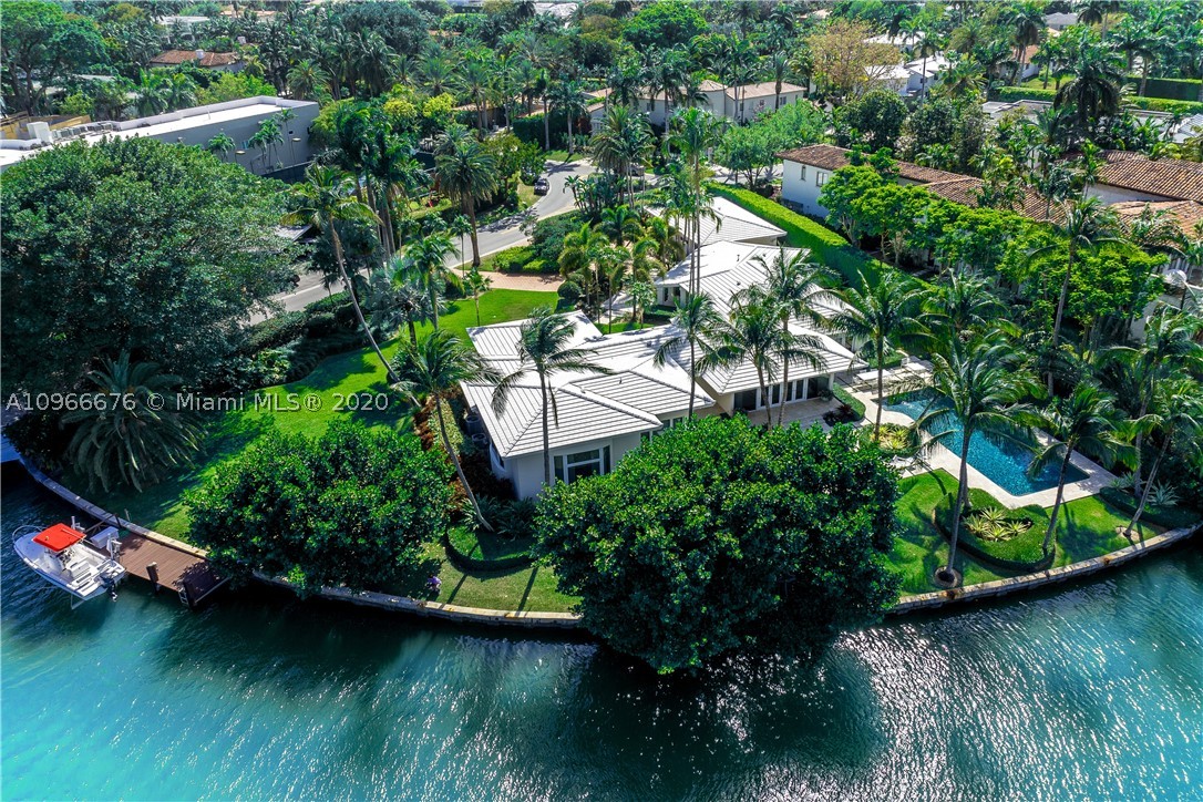 Contemporary one story estate, recently renovated to perfection, encompasses 6,096 SF of living space & sits on an expansive 31,890 SF lot. This truly magnificent home offers a grand entrance, stunning water views, an impressive 250 WF, a sprawling pool, beautiful lushly landscaped outdoors perfect for entertaining. Ample driveway & setback entry lead to stunning 5BD,5+1BA home w/gourmet kitchen w/ top of the line appliances, mesmerizing outdoor views from every room, natural light, expansive 12FT ceiling master bedroom & a 3 car garage. Live a life of sophistication and relaxation in this impeccable waterfront estate.