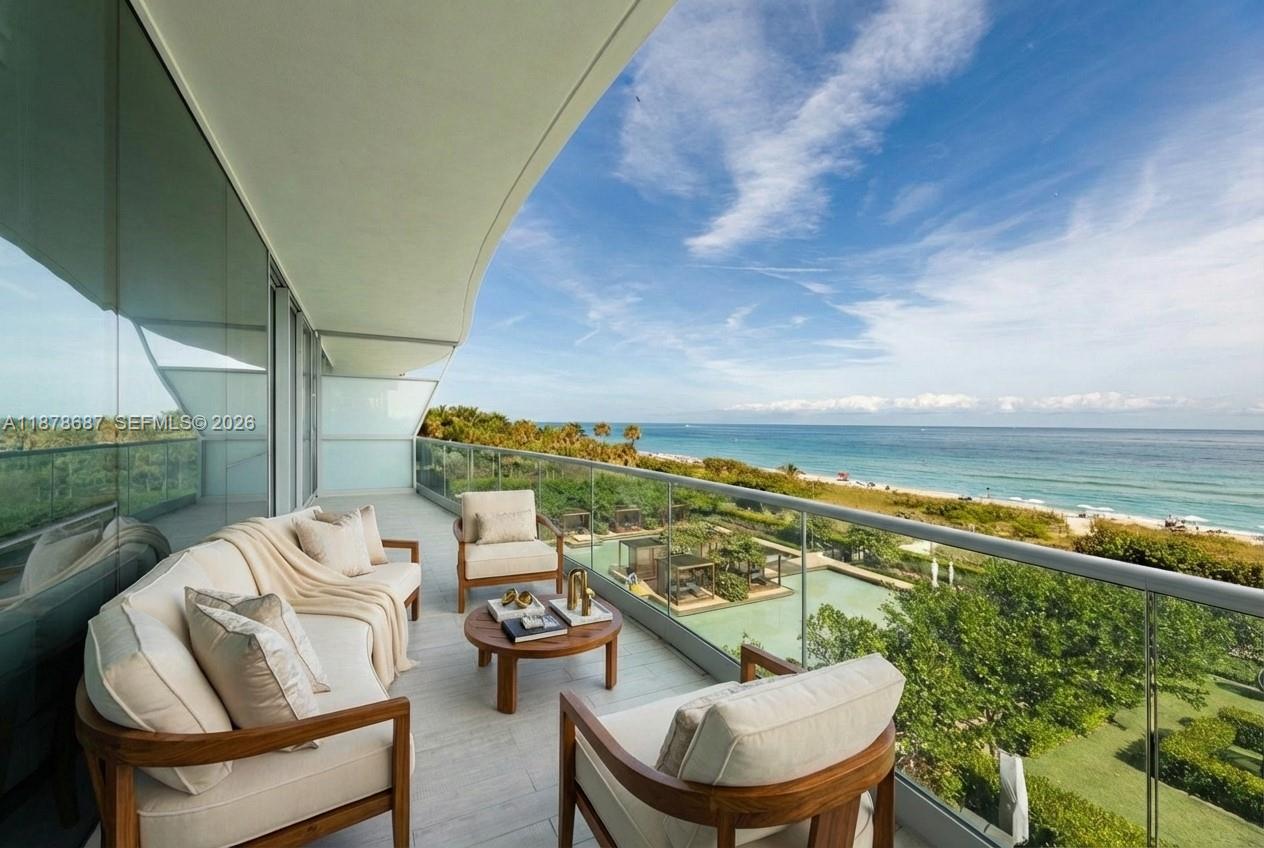 Spectacular beachfront corner residence at Fendi Château, an exclusive boutique building. East–west flow-through plan offers direct ocean and city views, nearly 6,000 SF, and wraparound terraces for sunrise-to-sunset living. A private elevator foyer opens to the living and dining area with 10-ft ceilings and Greek marble floors throughout. The Fendi-designed chef’s kitchen features “Mother of Pearl” finishes, a large island, and Gaggenau appliances. The primary suite, concealed behind elegant wood doors, reveals ocean views, dual custom closets, and a spa-inspired bath. With 4 bedrooms, 6.5 baths, and 2 staff quarters, this residence offers estate-like privacy. Amenities include 2 pools, spa, fitness center, cinema, residents’ restaurant, concierge, beach service and more.
