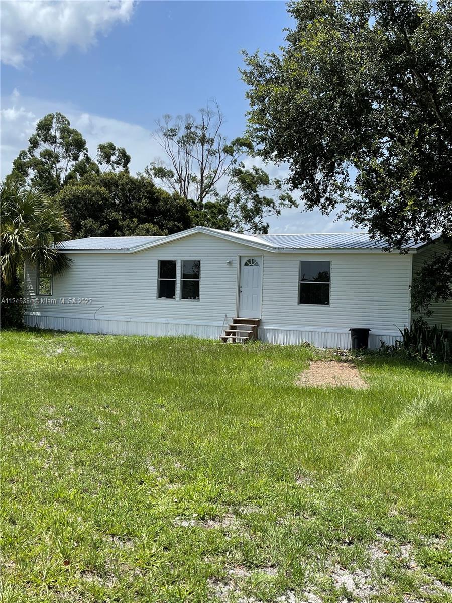 Gorgeous Mobil Home in FT DENAUD a very desirable area. Double wide 3 Bedroom 2 Bath on almost 2 acres of land and new roof.