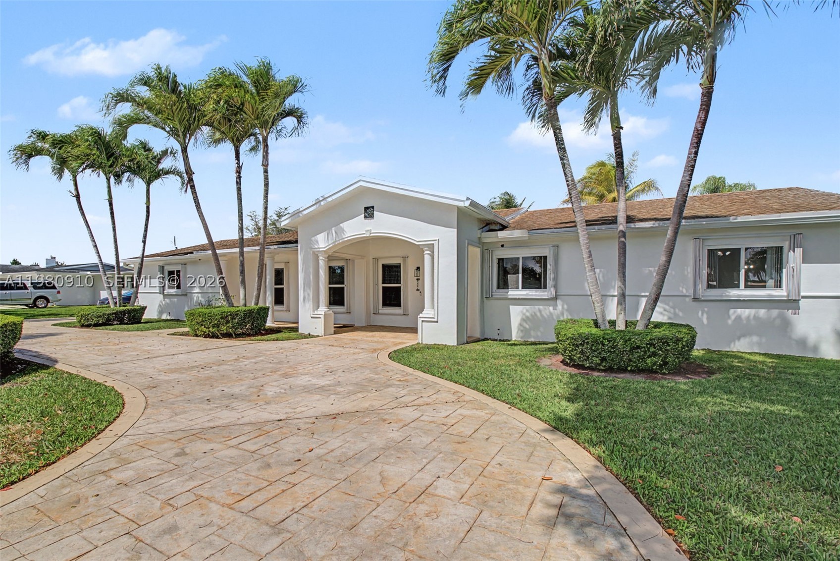 Well-maintained 4 bdrm/ 4 bath home in the unparalleled community of Mangowood in North Palmetto Bay. Charming front porch provides convenient covered entry. Open formal living/dining area. Eat-in kitchen with breakfast nook and a bay window overlooking the beautiful pool area connects to the family room. Tile and laminate flooring. Lovely primary suite with walk-in closets, marble primary bath, separate tub and shower. Spacious indoor laundry room w sink and cabinetry. Accordion hurricane shutters. Stamped concrete circular driveway. 2 car side entry garage. Fenced backyard with double gate and space for parking a boat. Screened pool and patio. A couple short blocks to Coral Reef Park complete with walking paths, youth sports, playground, community events and brand-new pickleball courts.