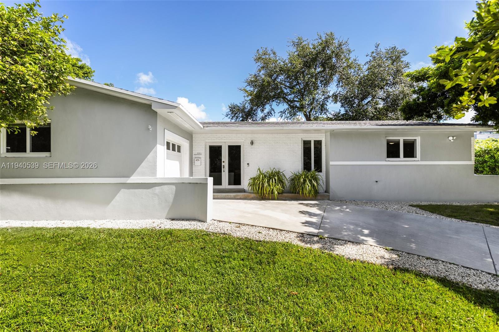 Set on a desirable corner lot in the heart of Silver Bluff, this well-kept 3-bedroom, 2-bath home offers comfortable, easy living with thoughtful details throughout. Bright living and dining areas are filled with natural light, creating a relaxed, easy flow. Impact windows, generous closets, and custom blackout shades in each bedroom add both function and comfort. The kitchen features granite countertops, ample cabinetry, a snack counter, and a walk-in pantry, opening seamlessly to the main living areas for effortless connection. Outside, a beautifully landscaped, fully fenced yard provides a private setting to unwind, entertain, or simply enjoy the outdoors. Ideally positioned just minutes from Coral Way, Coconut Grove, Coral Gables, and Miami International Airport, this home offers a lifestyle rooted in convenience, neighborhood charm, and accessibility.