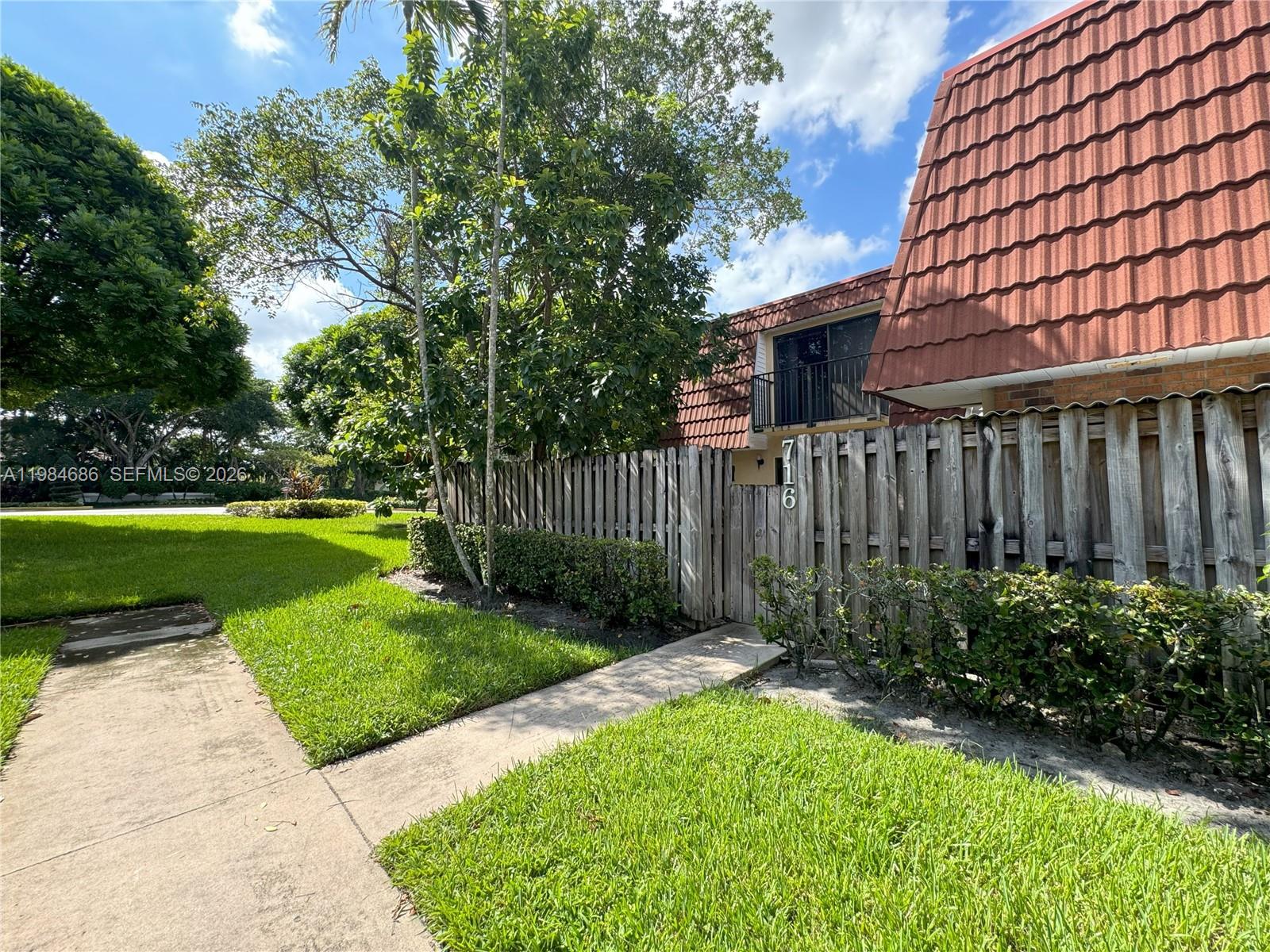 Highly desirable Waterford Courtyards of Jacaranda, Plantation! This spacious 2BD/2.5BA townhome offers 1,372 sq ft of comfortable living across two levels. The main floor features an open living/dining area, kitchen, laundry, half bath, and a private fenced courtyard — perfect for outdoor enjoyment. Upstairs, both bedrooms boast en-suite full baths and private balconies. Community pool, lush grounds, and two assigned parking spaces. Prime Plantation location — minutes from I-595, Sawgrass Mills, Plantation Central Park, and top dining and retail.