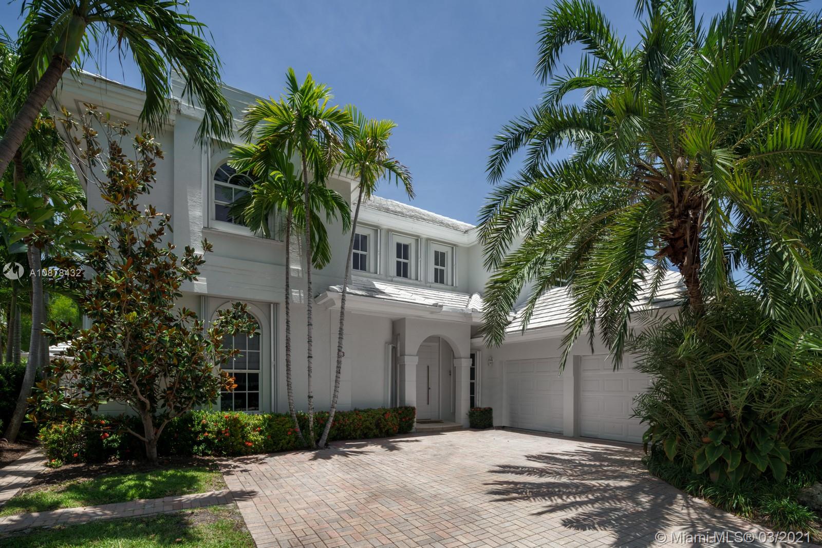 The original model home of Grand Bay Estates offers the best location, largest SF and lot size, almost double, of any home in this secure and gated Key Biscayne community.  A single family home, minus the hassles of maintenance, that offers beach access and membership to amenities of Ritz Carlton/Grand Bay Club.  This home is in immaculate, move in ready condition.  Large MB with custom WIC and upgraded bathroom.  Perfect upstairs den/office for working from home.  Current owners have added features such as: glass wine cellar dividing DR and newly renovated kitchen; wood & marble floors, glass railings, security and alarm system, surround sound, converted garage to 2nd family room, & more. Gorgeous back yard with built in BBQ, covered patio, deck & pool area is perfect for entertaining.