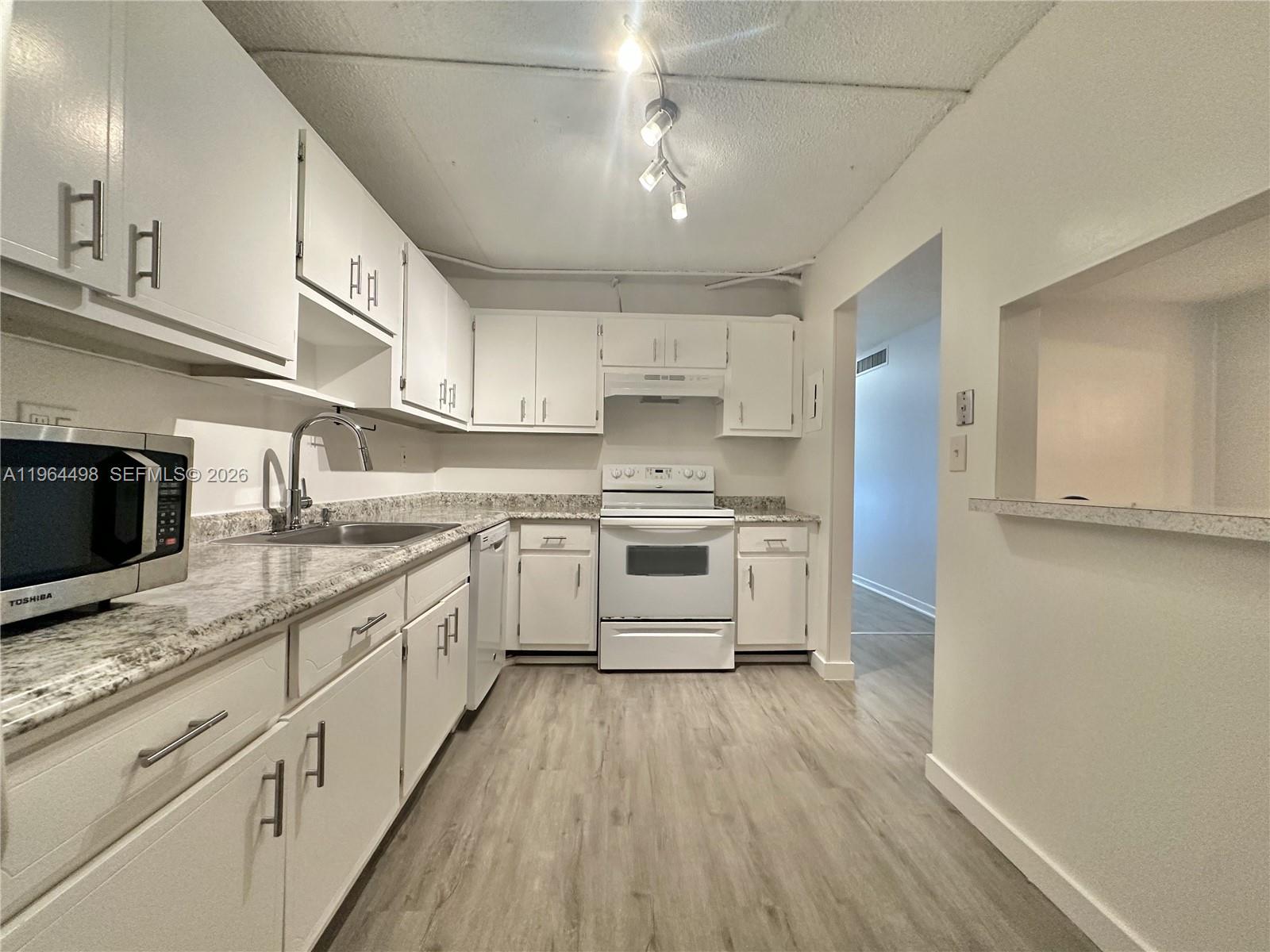 Fully renovated corner 1-bedroom, 1-bath residence offering 875 SF of bright and spacious living. Features a large kitchen with breakfast area, separate dining space, and comfortable living room layout. The unit has been completely updated and includes additional storage. Building offers laundry room on every floor. Ideally located within walking distance to university, shopping, supermarkets, restaurants, and public transportation, and just 5 minutes from the beach. Excellent opportunity for investors or end users seeking a move-in ready condo in a prime, convenient area.