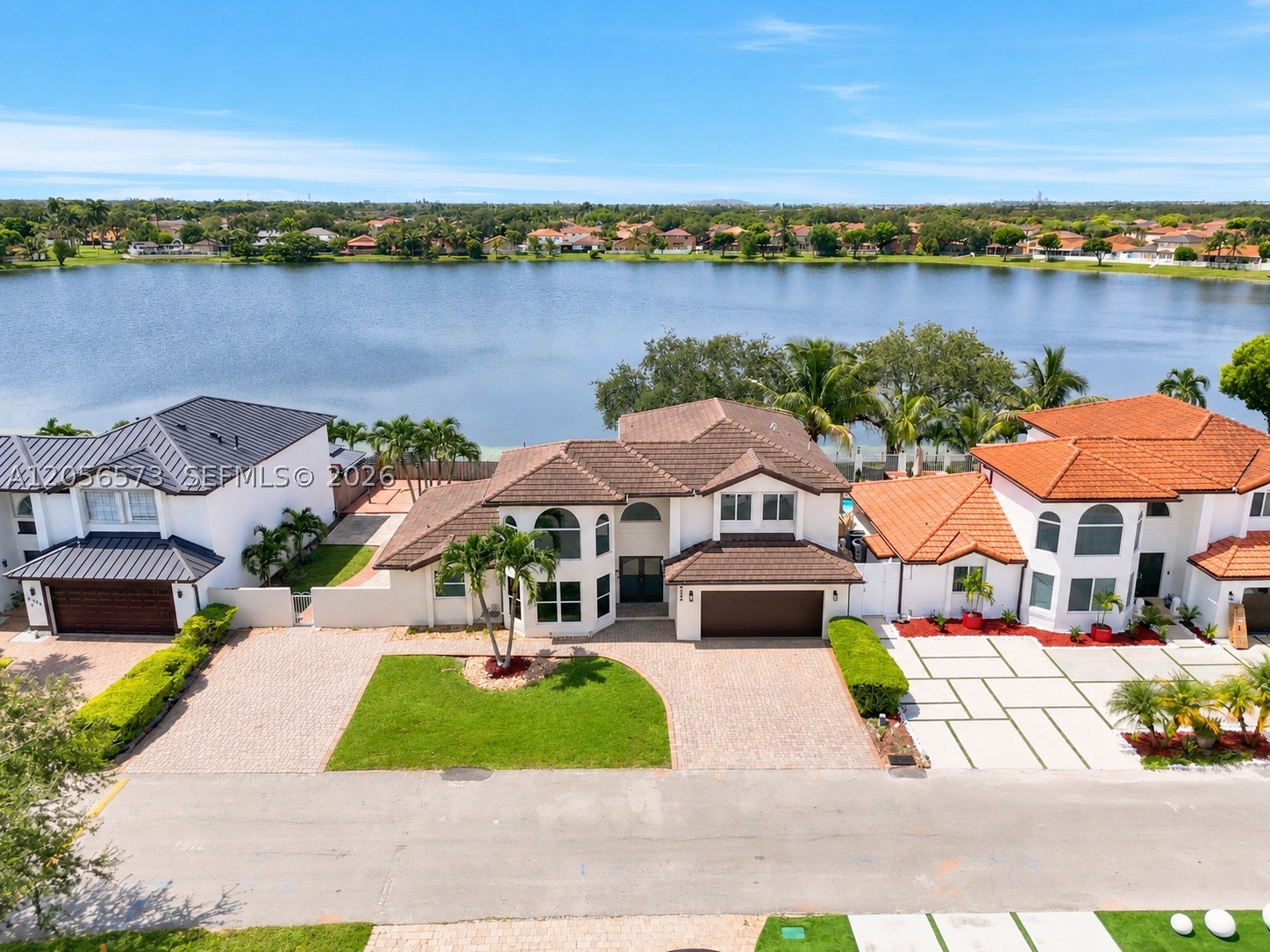 Welcome to this beautifully maintained 5-bedroom, 4-bath pool/lake home in the desirable Marbella Park community. Perfectly positioned on a tranquil lakefront lot with a scenic walking path just beyond the backyard, this spacious residence offers the ideal blend of comfort, functionality, and outdoor living. The thoughtfully designed floor plan features an expansive great room ideal for everyday living and entertaining, a bright eat-in kitchen overlooking the pool and lake, and generously sized bedrooms throughout. The impressive primary suite offers a private retreat with a spacious sitting area overlooking the pool, creating the perfect place to relax with peaceful water views. Property is vacant. Some photos have been virtually staged and/or digitally enhanced for marketing purposes.
The ADA-accessible primary bathroom has been designed for both convenience and comfort while maintaining a clean, modern feel. Step outside to enjoy your private pool, screened patio, and multiple outdoor entertaining spaces, all framed by serene lake views and direct access to the walking path behind the property. Roof replaced in 2021. Whether you’re hosting family and friends or enjoying quiet evenings by the water, this home offers exceptional indoor and outdoor living in one of the area’s most sought-after neighborhoods. A rare opportunity to own a spacious lakefront home with a pool, accessibility features, and an unbeatable setting.