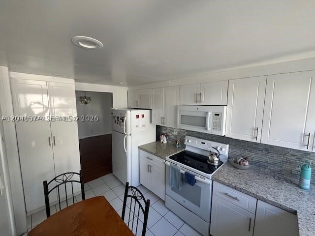 Spacious and fully updated 2-bedroom, 2-bath condo offering 1,192 sq ft of comfortable living in the desirable 55+ Lake Parc community. Bright open layout with abundant natural light. Gorgeous kitchen features granite countertops, brand-new cabinetry, and crown molding throughout. Both bathrooms have been tastefully renovated. Additional upgrades include a new A/C unit and updated electrical panel. Enjoy peaceful mornings with serene views from the primary bedroom. Community offers low HOA fees, making it an excellent value. Prime location just minutes from Aventura Mall, Brightline station, supermarkets, restaurants, and shops. Move-in ready!