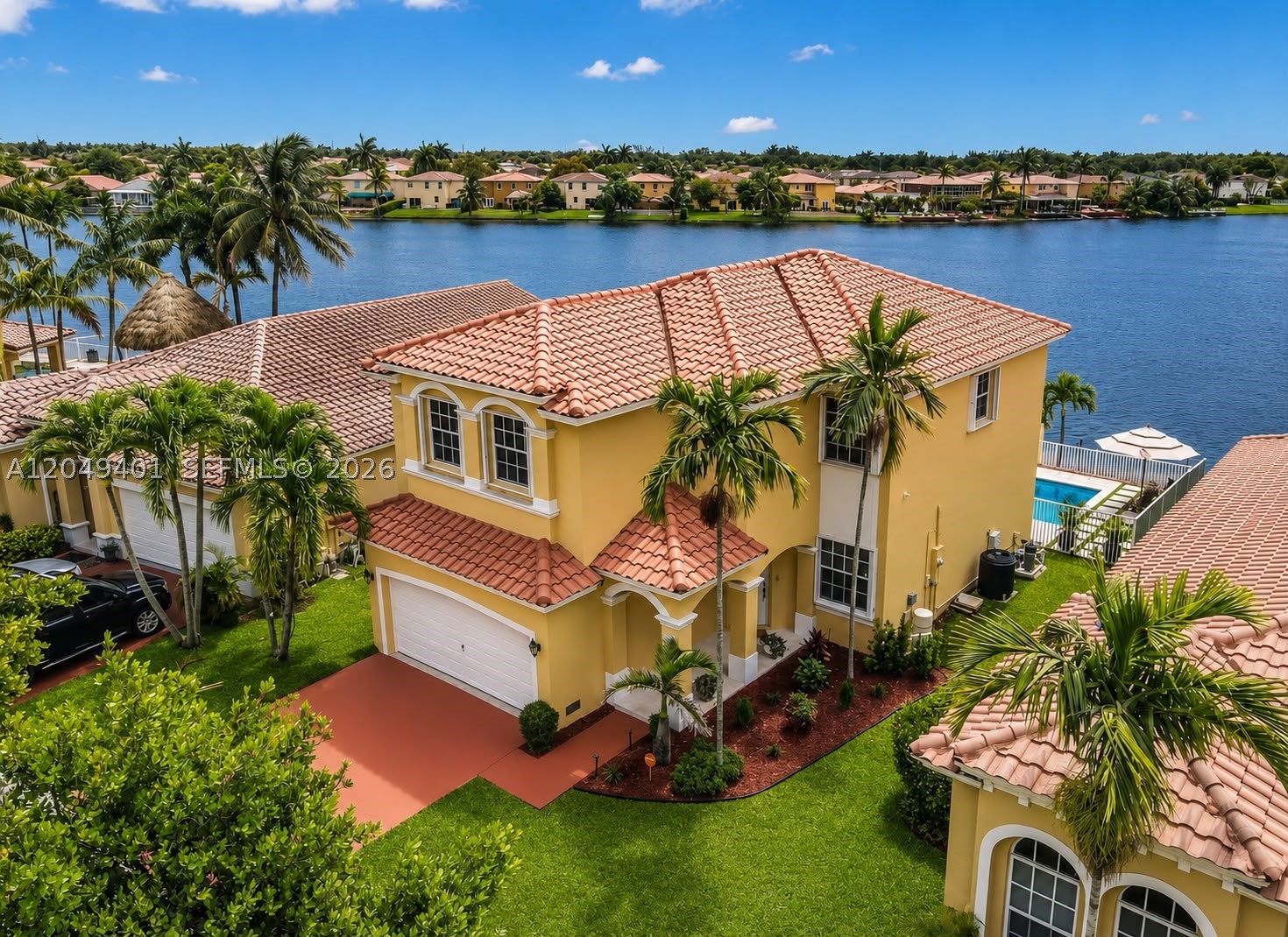 Welcome home to this stunning Lakefront Pool Home! 4BR 2.5 BATH residence located in the highly sought-after community of Vizcaya. Situated on a quiet cul-de-sac with no front-facing neighbors, this home offers a rare combination of privacy and serenity. As you enter, you are immediately welcomed by breathtaking panoramic lake and pool views creating a peaceful ambiance. The backyard features a resort-style saltwater pool (2020) with Jandy® Automation System & premium heating capabilities, allowing for effortless enjoyment and comfort year-round; remote-controlled lighting and expansive travertine pool deck designed for elevated outdoor living; Natural Lighting Throughout, oversized master bedroom with a deep closet and an elegant walk-in dual shower. Contemporary light fixtures, ceiling fans and thoughtful enhancements all throughout the home. Security cameras convey with the property and are equipped for convenient setup. Modern LG appliances, newer washer and dryer, A/C system with UV light and Reme-Halo Guardian air purification system, brand new water heater (2026), and a well-maintained roof. Beyond the home, Vizcaya offers an exceptional lifestyle with a 24-hour guard-gated entrance, 22,000 sqft clubhouse, resort-style pool, fitness center, playground, walking & biking trails. Conveniently located near I-75, the Florida Turnpike, premier shopping, dining, airports, and top-rated schools making this home the perfect blend of luxury, comfort and convenience.