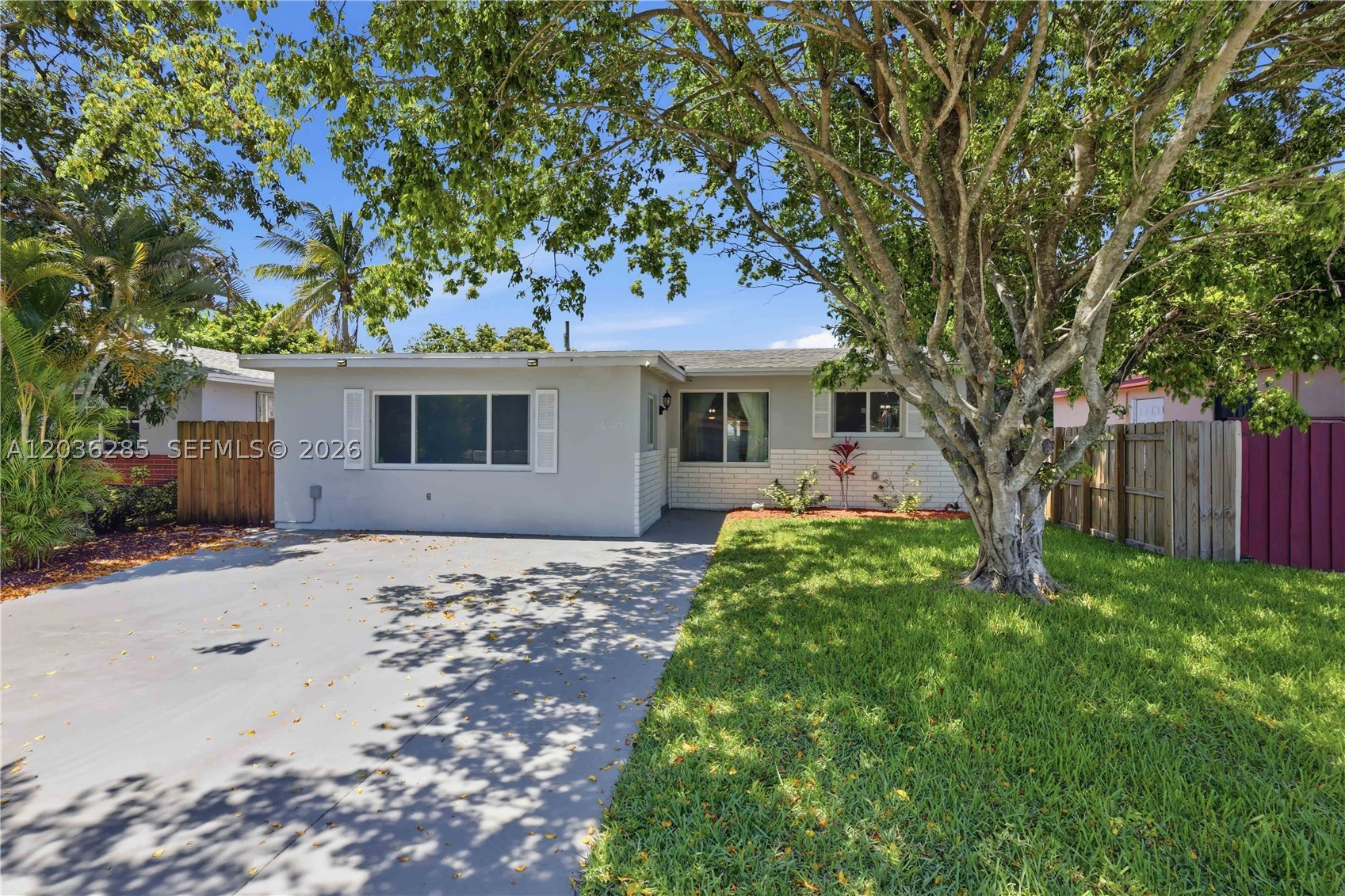Beautiful 3 bedroom, 2 bath home in the heart of Hollywood! This well-maintained property features a great kitchen with wood cabinetry, granite countertops, and stainless steel appliances, plus spacious common areas perfect for a game room, home office, family room, or additional entertaining space. Enjoy peace of mind with impact windows and doors, a 2023 A/C unit, 2026 tankless water heater, updated vinyl flooring, upgraded electrical panel, and sprayed attic insulation. The main roof was completed in 2015, and the flat roof areas were updated in 2023. The fully fenced backyard is ideal for relaxing and entertaining, featuring a Jacuzzi on a Trex deck, covered lanai, fire pit, and two storage sheds, including a 12' x 12' shed with power. The front driveway offers ample parking and a 30-amp RV hookup. Conveniently located minutes from Seminole Hard Rock, major highways, shopping, dining, and more. No HOA. Great opportunity for investors or first-time homebuyers. Schedule your showing today!