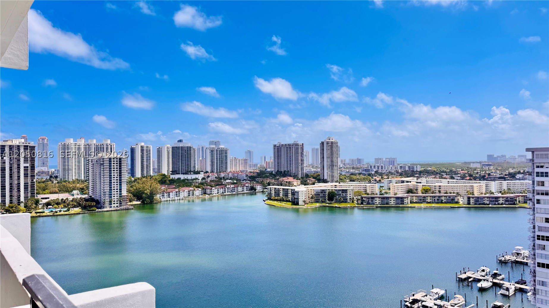 Stylish and spacious high-floor unit, clean and move-in ready with modern upgrades throughout. Features include a remodeled kitchen with granite countertops and stainless steel appliances, ceramic tile floors, renovated bathrooms, and a private balcony with stunning east-facing views of the lake, intracoastal, pool and marina. Open living/dining layout, primary suite with large walk-in closet. HOA includes cable, Wi-Fi, and hot water. Amenities include two heated pools, tennis courts, fitness center, marina, clubhouse, BBQ/picnic areas, billiards, ping pong, library, car wash area, attended lobby, concierge, 24/7 security, and assigned parking. Conveniently located, steps to shopping, restaurants, and entertainment. Minutes to Aventura Mall, parks, public transit, Brightline station, major roadways, and Sunny Isles Beach.