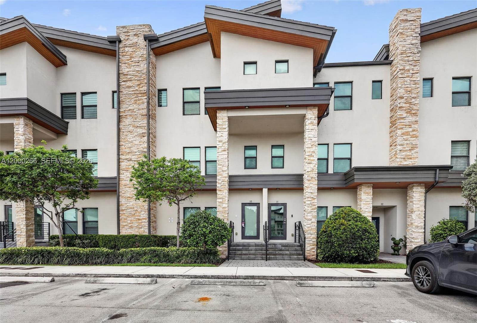 Modern split-level contemporary townhome in the highly sought-after Highland at Park Central. This beautifully upgraded 3-bedroom, 2.5-bath residence features a unique split-level design with all bedrooms located upstairs, offering privacy and comfort with generously sized rooms. The home showcases a bright, open-concept layout with porcelain flooring throughout, impact glass, quartz countertops, stainless steel appliances, and sleek, modern finishes. Spacious living and dining areas flow effortlessly, creating the perfect setting for both everyday living and entertaining. Additional highlights include a private balcony, in-unit washer and dryer, and extra storage space for added convenience. Enjoy resort-style living with an exceptional collection of amenities, including a swimming pool with sun deck, fitness center, sauna, billiard room, tennis and basketball courts, soccer field, children’s water park, playground, and more. Ideally located near shopping, dining, and major highways, this home offers the perfect blend of style, comfort, and lifestyle.