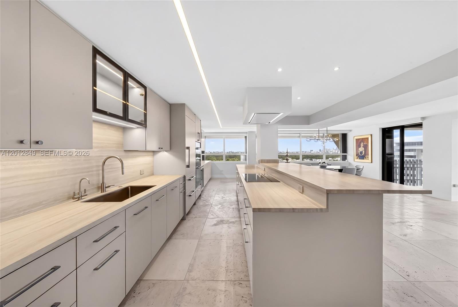 Welcome to Residence A1809 at 1 Grove Isle, a completely renovated 3-bedroom, 2.5-bathroom home in the sky spanning 2,614 square feet and offering breathtaking panoramic views in every direction. From sunrise over Biscayne Bay to the sparkling skyline of Downtown Miami, with sweeping vistas of Coral Gables and Coconut Grove, every room captures a stunning perspective.  Thoughtfully redesigned with modern elegance, the residence features top-of-the-line Sub-Zero and Miele appliances, including a double wall Miele oven, paneled Sub-Zero refrigerator doors, and a wine refrigerator—perfectly suited for both everyday living and entertaining.  Sleek finishes and a seamless blend of style and comfort define the interiors, complemented by motorized shades and a beautifully executed, well-designed California Closets system for optimal organization.  Set within a private, guard-gated island community with 24-hour security, this is resort-style living at its finest—where every day feels like a vacation. Don’t miss the opportunity to call this exceptional residence home.
