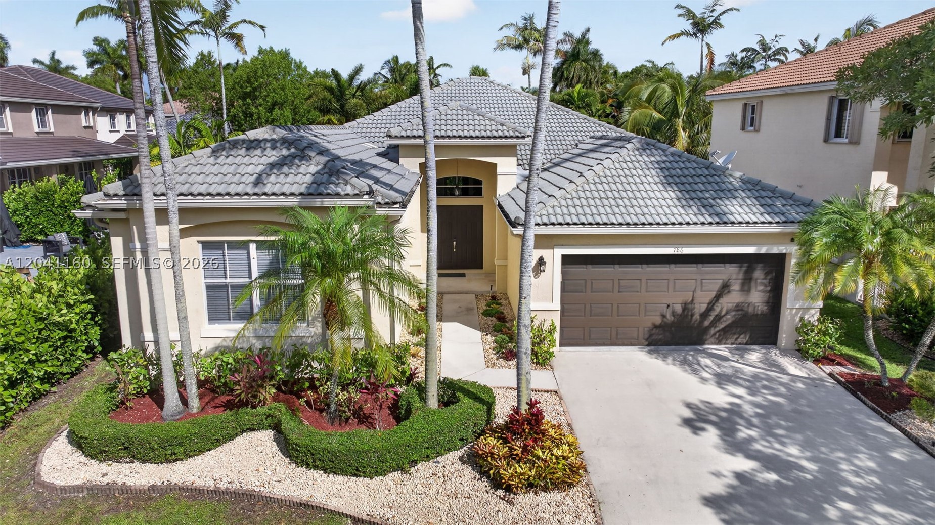 Beautiful 4-bedroom, 2.5-bath Bougainvillea model in the highly sought-after gated community of Savanna in Weston! This meticulously maintained home features a spectacular 15' x 30' swimming pool with a 6' x 6' spa, creating the perfect backyard for entertaining, and enjoying the Florida lifestyle. Just painted interior in a bright, modern white, enhancing the home's open, light-filled spaces and soaring 10-foot ceilings. The updated kitchen features stainless steel appliances, ample cabinet and counter space, and opens to the breakfast area and family room. The primary suite offers sliding glass doors leading to the covered patio and pool, a large custom walk-in closet with built-in organizers, and a spacious en-suite bath with separate shower and soaking tub. The secondary bathroom has been tastefully updated. Split-bedroom floor plan for added privacy, an indoor laundry room, and a 2-car garage. Savanna residents enjoy a spectacular resort-style clubhouse with multiple pools, water slide, mini golf, basketball court, playgrounds and pickleball. Located next to Weston Regional Park and the YMCA, offering over 100 acres of recreation including baseball, soccer and football fields, pickleball, basketball, walking trails, aquatic programs, fitness facilities, and year-round activities. Zoned for Weston's top-rated A+ schools and conveniently located near shopping, dining, parks, and major highways. Great opportunity to own one of Savanna's most popular floor plans!