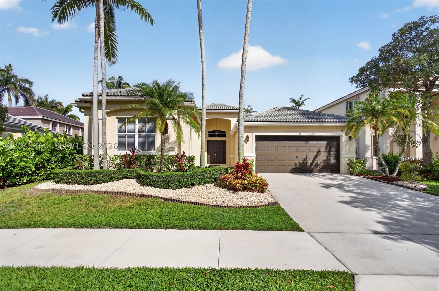 Beautiful 4-bedroom, 2.5-bath Bougainvillea model in the highly sought-after gated community of Savanna in Weston! This meticulously maintained home features a spectacular 15' x 30' swimming pool with a 6' x 6' spa, creating the perfect backyard for entertaining, and enjoying the Florida lifestyle. Just painted interior in a bright, modern white, enhancing the home's open, light-filled spaces and soaring 10-foot ceilings. The updated kitchen features stainless steel appliances, ample cabinet and counter space, and opens to the breakfast area and family room. The primary suite offers sliding glass doors leading to the covered patio and pool, a large custom walk-in closet with built-in organizers, and a spacious en-suite bath with separate shower and soaking tub. The secondary bathroom has been tastefully updated. Split-bedroom floor plan for added privacy, an indoor laundry room, and a 2-car garage. Savanna residents enjoy a spectacular resort-style clubhouse with multiple pools, water slide, mini golf, basketball court, playgrounds and pickleball. Located next to Weston Regional Park and the YMCA, offering over 100 acres of recreation including baseball, soccer and football fields, pickleball, basketball, walking trails, aquatic programs, fitness facilities, and year-round activities. Zoned for Weston's top-rated A+ schools and conveniently located near shopping, dining, parks, and major highways. Great opportunity to own one of Savanna's most popular floor plans!