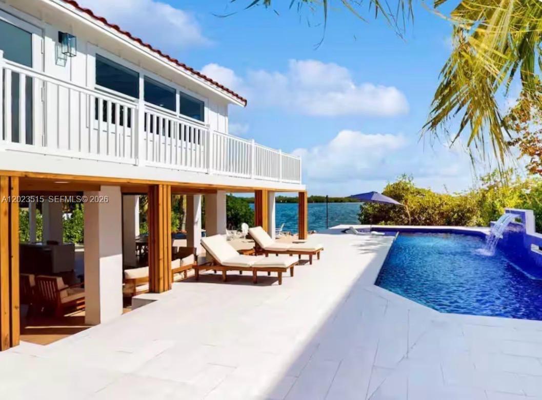 Welcome to your luxurious waterfront tropical paradise in the heart of Key Largo. This stunning fully renovated waterfront estate offers the perfect blend of modern luxury, coastal elegance, and resort-style living.
5 spacious bedrooms | 3 beautifully designed bathrooms.
Oceanfront with private dock/boat lift and open ocean views— ideal for yachts, fishing boat, and waterfront living.
Resort-style pool and expansive outdoor entertaining areas.
Fully renovated with luxurious modern coastal finishes.
Soaring vaulted wood-beam ceilings and bright open-concept design.
Designer chef’s kitchen with oversized island, quartz countertop, and profesional grade luxurious appliances.
Spacious indoor and outdoor living areas perfect for entertaining
Vacation-rental friendly with exceptional income potential
Move-in ready in one of Key Largo’s most desirable luxury locations
Enjoy the ultimate Florida Keys lifestyle with private boating access right from your backyard or go kayaking thru John Pennekamp state park’s expansive pristine mangrove tunnels and enjoy the florida keys spectacular eco-system and wildlife from the privacy of your own home. Spend your days on the water, relaxing poolside, or entertaining while enjoying breathtaking sunrises and tropical views.
Whether you are searching for a luxury primary residence, vacation getaway, or investment property, this exceptional Key Largo waterfront home delivers the perfect combination of elegance, comfort, and island living.