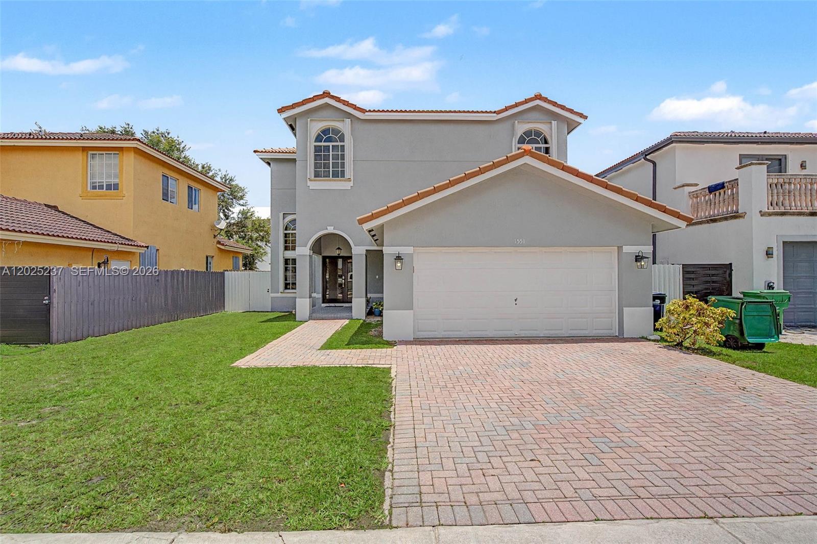 Fantastic, light and bright, 4-bedroom 3 bath, 2 story home built in 2007. Lovely formal foyer entry with double doors. Open formal living and dining room with volume ceilings. Modern Porcelain flooring. Welcoming, cozy kitchen complete with breakfast nook, features counter seating and pantry, and opens to the family room. 1 guest bedroom and full bath located downstairs. Upstairs you will find 3 additional bedrooms including the primary suite complete with walk-in closets and primary bath with dual sinks, separate shower and soaking tub. Indoor laundry room. Accordion hurricane shutters. Low maintenance, fenced yard. 2 car garage.