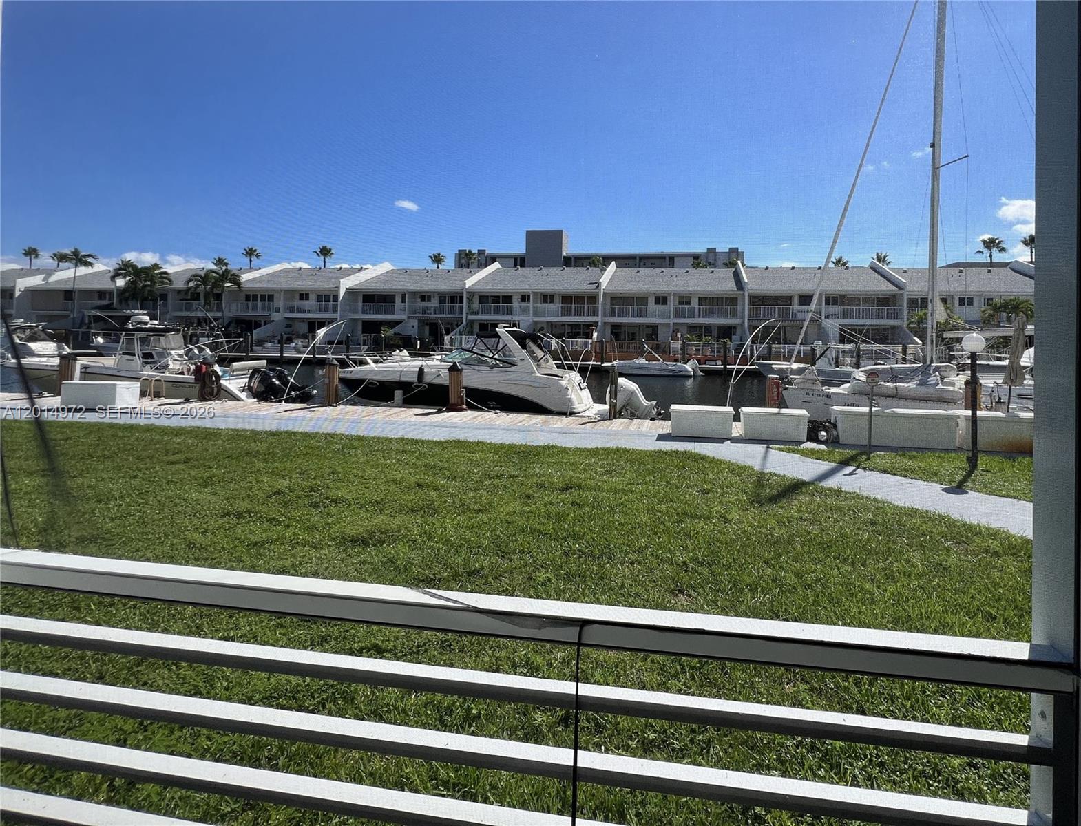 Unique opportunity to own a remodeled  2 bed/2 bath plus den condo on the first floor, unit fixtures a 100 year deeded 40ft dock in the back of the unit along with parking space un the front door, just walk to your boat or watch it from your porch. Open kitchen redesign, washer and dryer hook up in the unit. Building has recently replaced roof, balconies were restored and building has been painted along with driveways, plenty of visitor's parking spaces.  Seller will consider financing, ask for details.