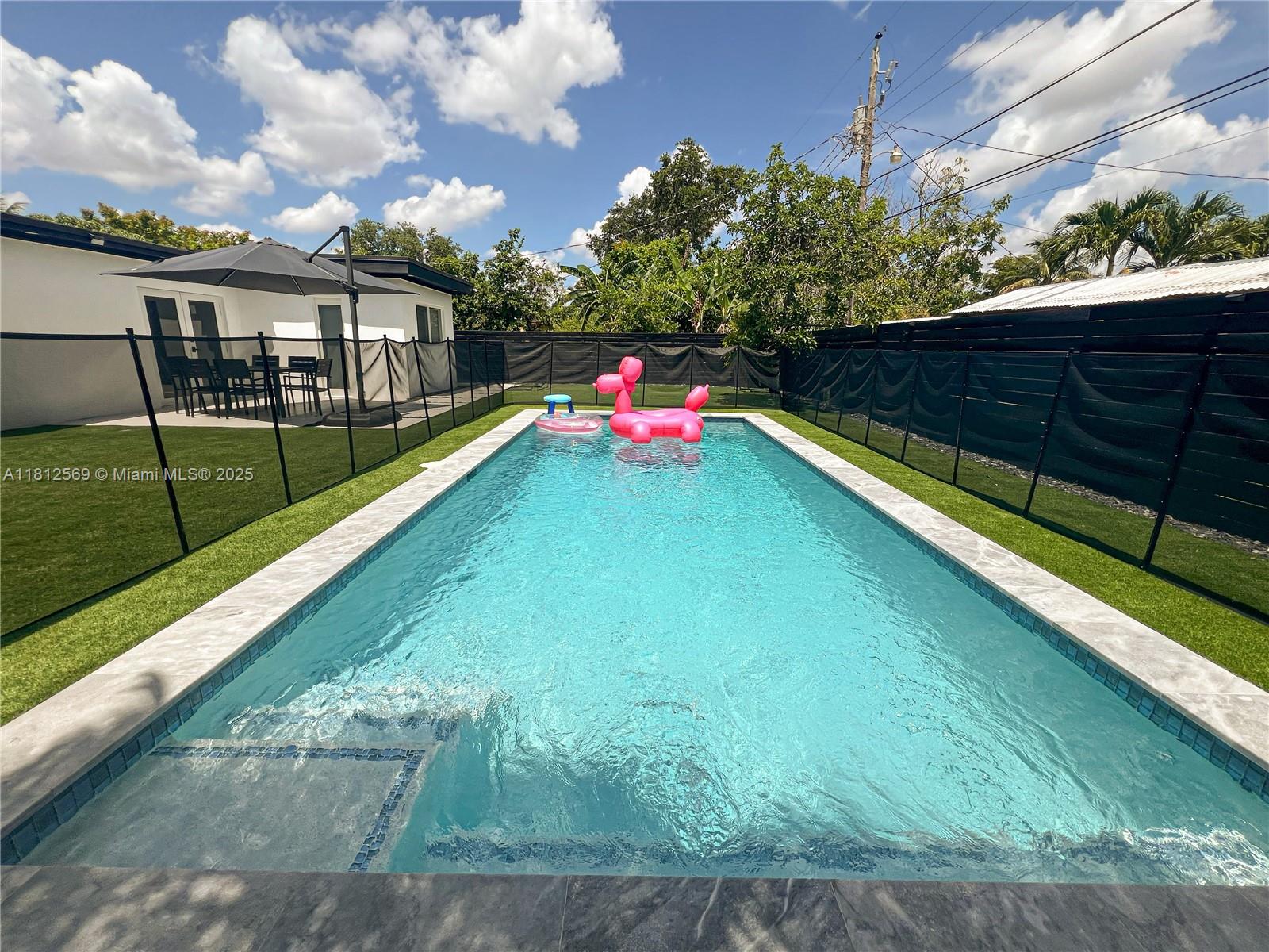 Absolutely stunning, fully furnished home—completely renovated from top to bottom! This turnkey property features all-new electrical, plumbing, appliances, kitchen with large island and elegant quartz countertops, as well as new walls, roof, flooring, and water heater. Enjoy resort-style living with a brand-new pool, turf-covered backyard, hot/cold outdoor shower, updated stairs, and sleek new driveway. No detail was overlooked in this modern transformation—move right in and start living your dream!