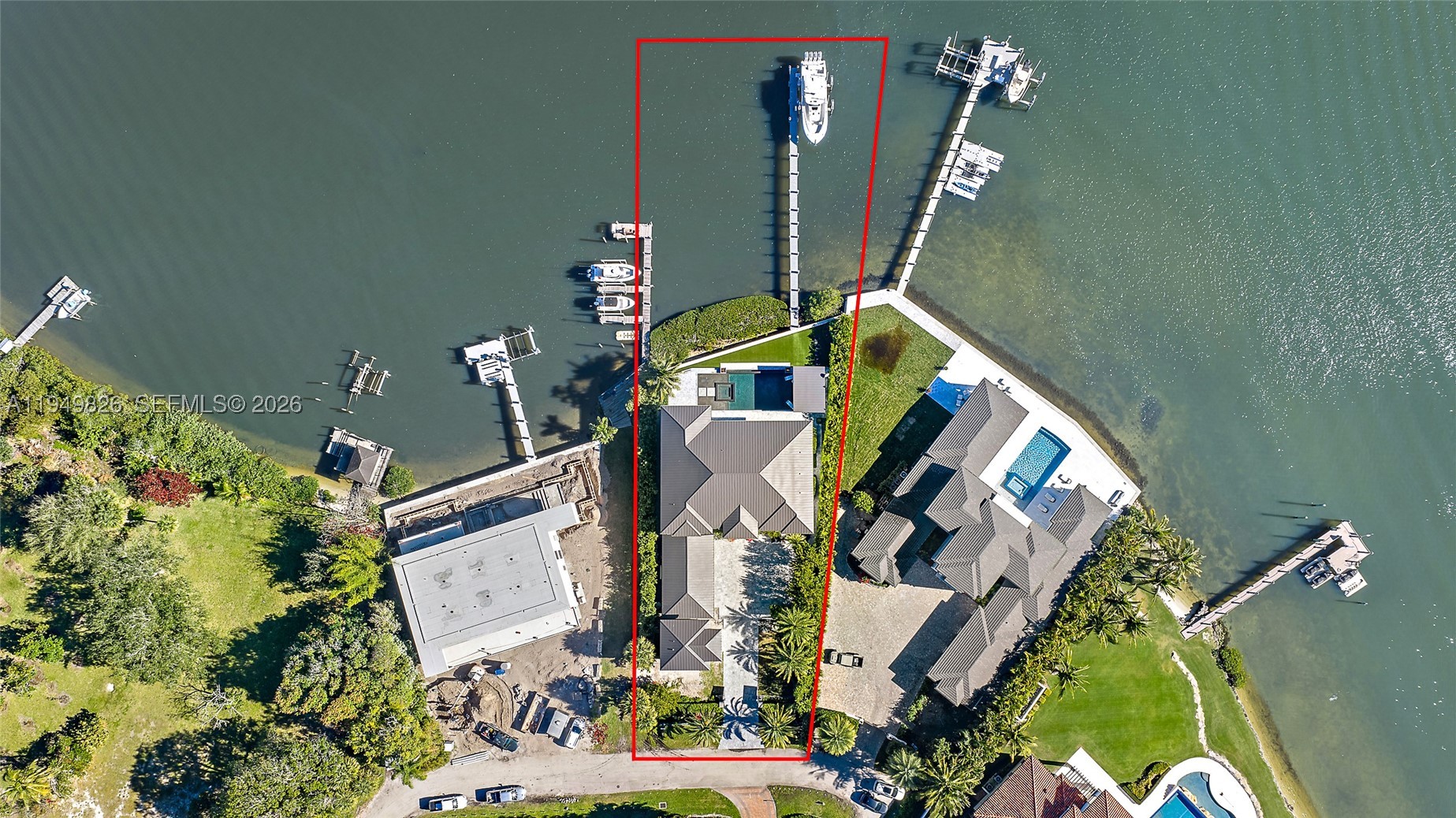 Waterfront estate home built in 2022, ideally positioned on a quiet street with fewer than ten homes and offering some of the most impressive views Jupiter has to offer. Designed with sleek, modern architecture, the residence is complemented by a separate guest house, providing flexibility for visitors, extended family, or a private office. Enjoy true waterfront living with a 50,000-lb boat lift and direct ocean access right from the backyard. Perfectly situated near Jupiter's iconic sandbars, waterfront restaurants, and everything the area's famous waterways have to offer. The outdoor living space is designed for year-round enjoyment, featuring a resort-style pool and spa, expansive turf areas, multiple fire pits, and an exceptional summer kitchen with a gazebo—creating the