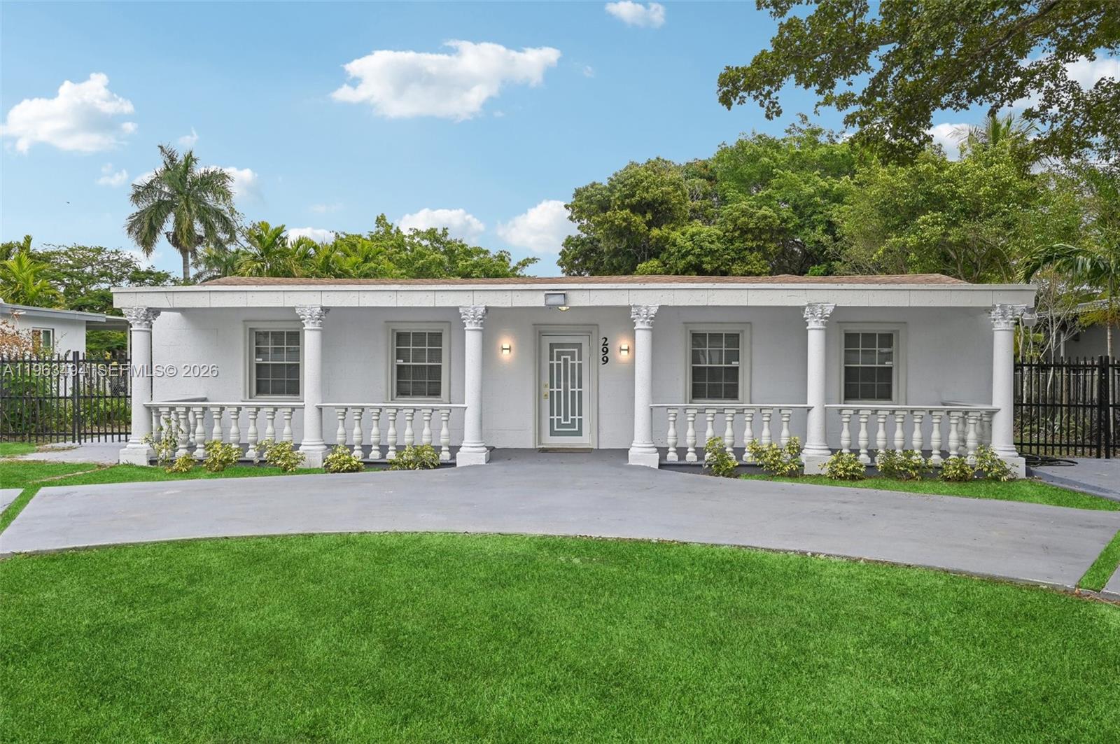 This stunning 3-bedroom, 2-bathroom waterfront home spans over 2,400 square feet and sits on an oversized lot with its own private boat ramp. Designed for entertaining, the home features a bright, open layout with abundant natural light and a sprawling outdoor space complete with a wooden deck. The lush landscaping includes mango, lychee, and other fruit trees, with ample room to add a pool or spa. Move-in ready, the property boasts a brand-new kitchen, updated flooring, a tankless water heater, and a circular driveway with automated gates. Conveniently located just minutes from I-95, hospitals, and popular dining and shopping spots, this home blends comfort, style, and accessibility seamlessly.