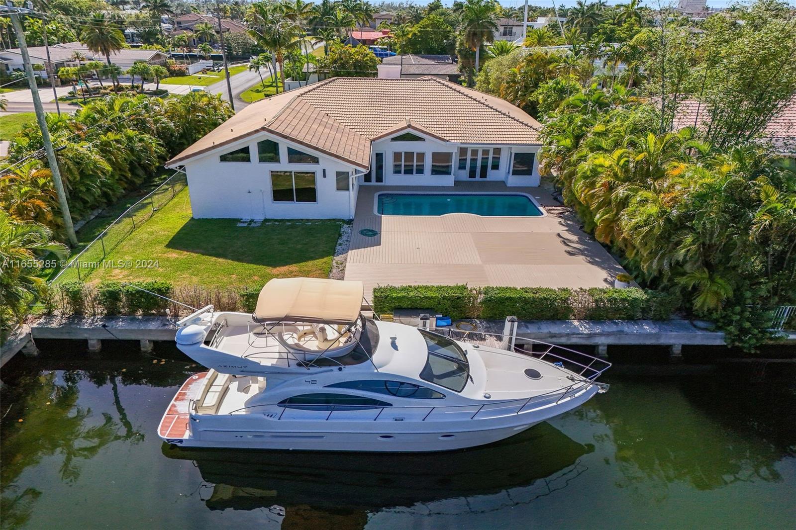 Step into luxury with this stunning 5-bedroom, 4-bathroom home nestled in Hallandale Beach, right on the water. Begin your days with breathtaking views of the expansive backyard, perfect for hosting and relaxing pool days. The home has undergone beautiful upgrades including a brand-new kitchen, bathrooms, and more, all designed to elevate your living experience. With high-volume ceilings throughout, the spaciousness and elegance of the home are truly remarkable. Park with ease in the 2-car garage, which offers comfortable space for your vehicles. Plus, enjoy the convenience of private docks right in the back of the house, adding a touch of waterfront luxury to your lifestyle. This property is stunning and a must see.