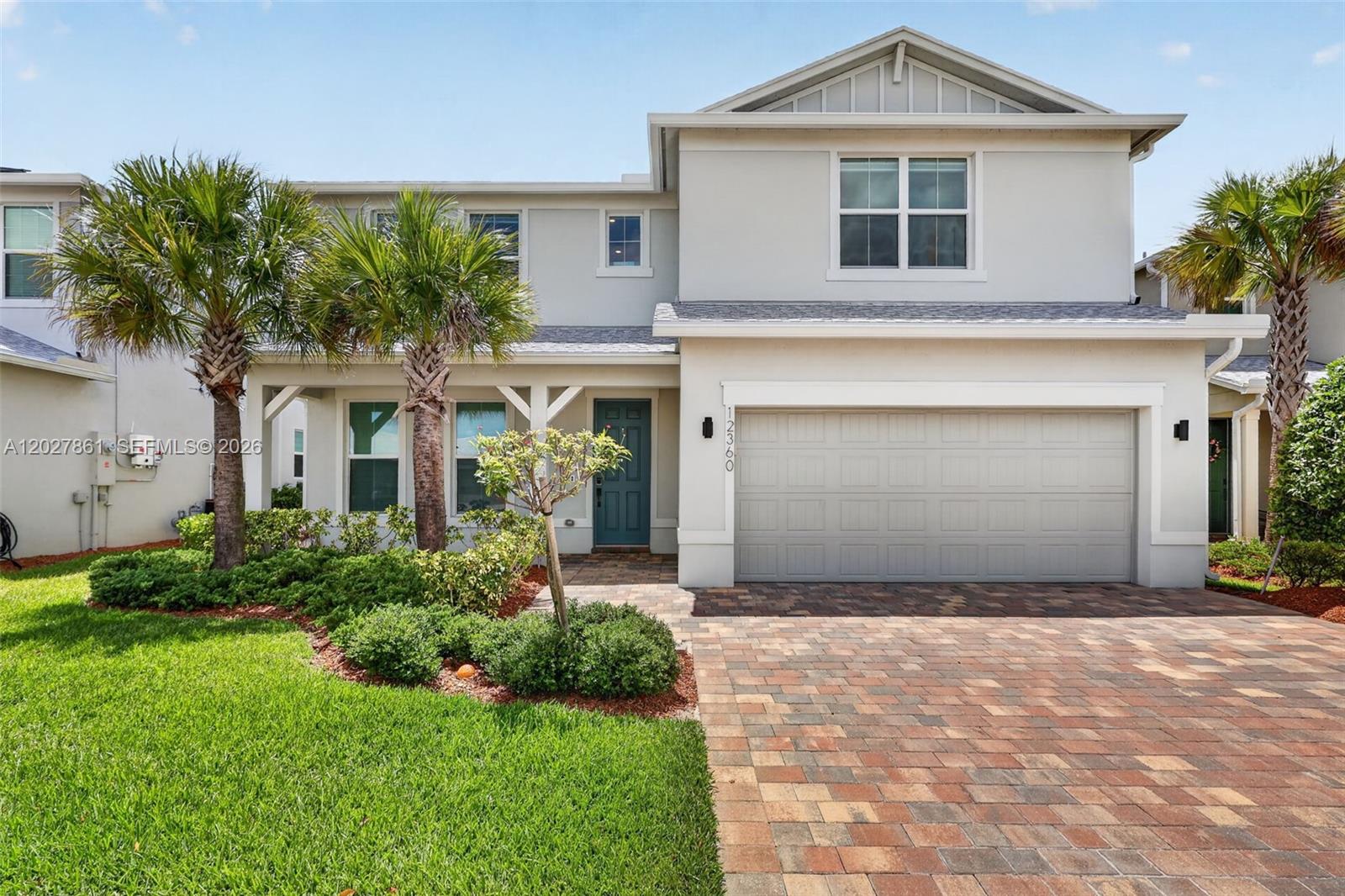 Built in 2023, this beautifully upgraded 5-bedroom, 4-bathroom home with a spacious upstairs loft offers the perfect blend of modern design, functionality, and comfort in the gated community of Heron Preserve at Tradition. A highly sought-after floorplan featuring both the primary suite and an additional bedroom and full bathroom on the first floor provides flexibility for guests, extended family, or a home office. The gourmet kitchen is the heart of the home, showcasing upgraded shaker cabinetry, quartz countertops, stainless steel appliances, a gas cooktop, and an oversized island perfect for entertaining. The first-floor primary suite offers a large walk-in closet and a luxurious bathroom complete with dual vanities, soaking tub, and separate shower. Upstairs, you'll find three bedrooms along with a spacious loft ideal for a media room, playroom, or second living area. Additional upgrades include epoxy garage floors, EV charging stations, slat walls and ceiling storage in the garage, widened driveway, home water filtration system, and all impact windows and doors. Situated on a deep lot with plenty of room to add a pool, this home offers the perfect blend of indoor and outdoor living. Heron Preserve features a gated entrance and resort-style amenities including a community pool, cabana, playground, and walking trails. HOA fees include cable, internet, and lawn maintenance. You're minutes from Tradition Town Square, shopping, dining, I-95, and the Florida Turnpike.