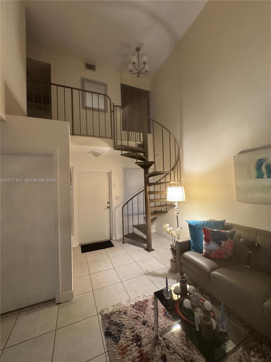 Two story condo in a gated community. the unit features a master bedroom on the second floor with a large walk-in closet and a full bathroom. On the main floor, there is a second bedroom with a full bathroom. The condo also includes an updated kitchen and an in-unit washer and dryer. The community offers a pool and playground area for residents.