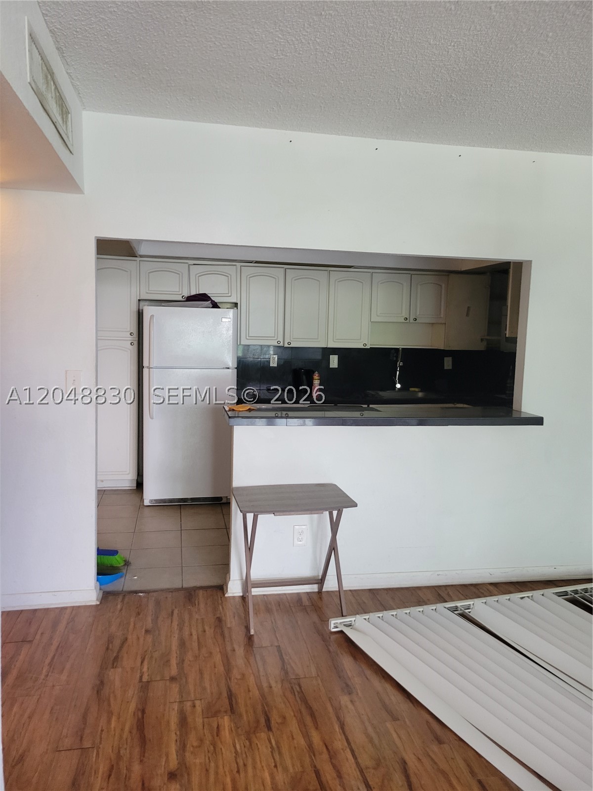 Handyman Special! Fantastic opportunity to renovate and create your dream home or investment property. This 2-bedroom, 2-bath condo features a den/home office that can easily be used as a third bedroom and is located on a low floor in a building undergoing a complete renovation. Ideally situated across the street from the beach, close to houses of worship, and just over the William Lehman Causeway from Aventura Mall, shopping, restaurants, grocery stores, and the city shuttle. An unbeatable location with outstanding potential.