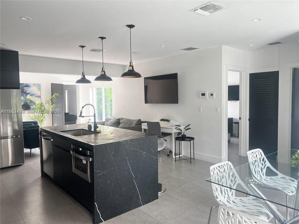 Beautifully renovated 4BD/3BA Miami home on a large 7,200+ sq ft lot. Features modern finishes, impact windows, updated kitchen, spacious layout, and a private backyard with pool. Located minutes from Wynwood, Design District, Midtown, and Miami Beach. Zoned T4-L—ideal for end-users or short-term rental investors. Turnkey, stylish, and perfectly positioned for strong appreciation and rental income.

ADJACENT LOT is T4L corner lot as well almost same size but with a multifamily Asking price on that one is additional $1850000