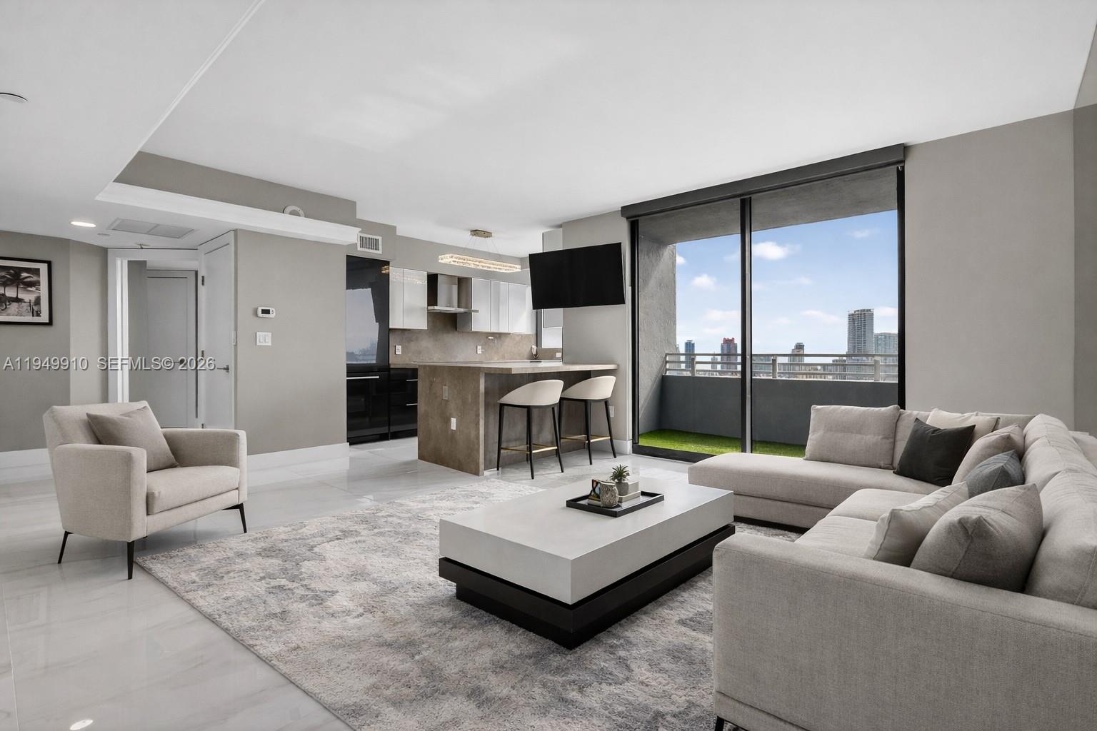 Live the South Beach dream life in this updated modern residence set within The Waverly, an exquisite high-rise that embodies the iconic Miami lifestyle. Enjoy stunning panoramic views of the bay and city skyline from this beautifully designed 2-bedroom, 2-bath home offering luxury living at its finest. The open-concept layout is highlighted by a sleek, modern kitchen with stylish cabinetry and top-of-the-line Bosch appliances, creating the perfect space for both everyday living and entertaining. Upscale finishes and fixtures are thoughtfully integrated throughout, giving the interior a refined yet relaxed feel.
The spacious primary bedroom features a walk-in closet with custom cabinetry and dimming lights, along with a window framing views of Star Island and the world’s largest cruise ship port. The residence also includes a fully updated, custom-built in-unit washer and dryer for added convenience.
The Waverly offers state-of-the-art amenities including 24-hour security, resort-style pools, tennis court, spa, yoga room, party room, and entertainment room. Ideally located within walking distance to Lincoln Road, Sunset Harbor, and Flamingo Park, and just moments from top restaurants, Whole Foods, and Trader Joe’s, this home truly stands out as a gem on Miami Beach—offering the best of South Beach living.