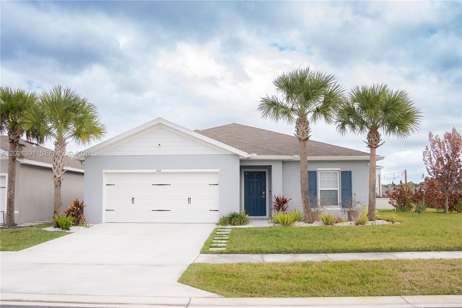 Beautiful 4-bedroom, 2-bath home in Avalon Crossing on an oversized lot. Features include custom closets in every bedroom, custom wood pantry and laundry closet, updated kitchen and baths, stainless steel appliances and smart home upgrades. Automatic blinds, zebra blinds, curtain rods, and blackout curtains. Garage includes epoxy floors and AC, great for a workspace, home gym, or lounge area.
Backyard features a large patio, fire-pit area, market lighting, and marble and river rock landscaping. Private irrigation well significantly reduces water costs.
Conveniently located near I-95, Florida’s Turnpike, shopping, dining, Tradition, and local beaches.