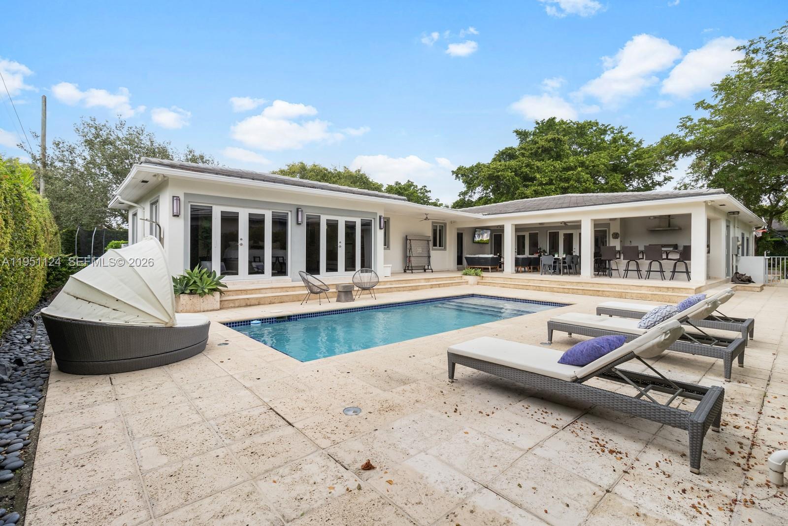 Situated on a prime corner lot along one of Coral Gables’ most picturesque, tree-lined streets, this distinguished 5-bedroom, 4-bath residence offers a rare combination of immediate livability, income-producing potential, and long-term upside.

The home features a well-balanced layout ideal for everyday living and entertaining, with generous interior spaces, a private pool, outdoor entertaining areas, and classic Coral Gables character. Its corner setting provides exceptional street presence, abundant natural light, and enhanced privacy.

The property is currently tenant occupied with a lease in place through February 14, 2027, making it especially appealing to buyers planning future occupancy while benefiting from rental income during the interim period.

Additionally, the owners have completed extensive architectural, engineering, and interior design plans for a substantial future expansion to approximately 5,000 square feet. These plans have been approved by the City of Coral Gables Architectural Review Board, significantly reducing design time and uncertainty. The plans are entirely optional and available upon request, allowing buyers to enjoy the home as-is or pursue the expansion at their discretion. Final permits to be obtained by buyer.

A compelling opportunity to acquire a corner-lot Coral Gables residence offering location, flexibility, and long-term vision.