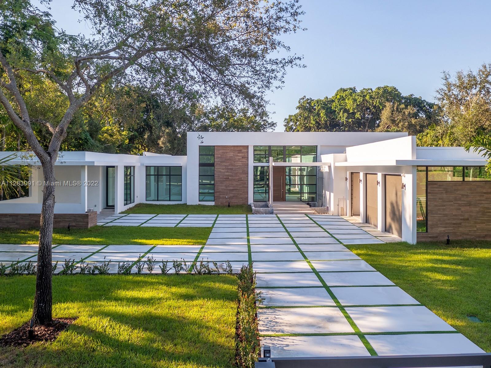 State-of-the-art 2022 Brand-new Modern estate in Pinecrest built w/the finest finishes and details. This stunning home welcomes you with a one-of-a-kind open floor plan offering volume ceilings, panoramic views of the serene outdoors. Discover expansive living areas including an Italian-style chefs eat-in kitchen with Wolf/SubZero appl, butler’s pantry and wine gallery. Lavish master suite offers walk-in closets, spa bath w/ floating tub and rain shower. Find a spectacular backyard oasis featuring huge pool w/tanning ledge, jacuzzi, covered terraces, custom built-in summer kitchen and huge yard. Additional features: guest/in-law suite, maids rm, laundry rm, & 3 car garage.