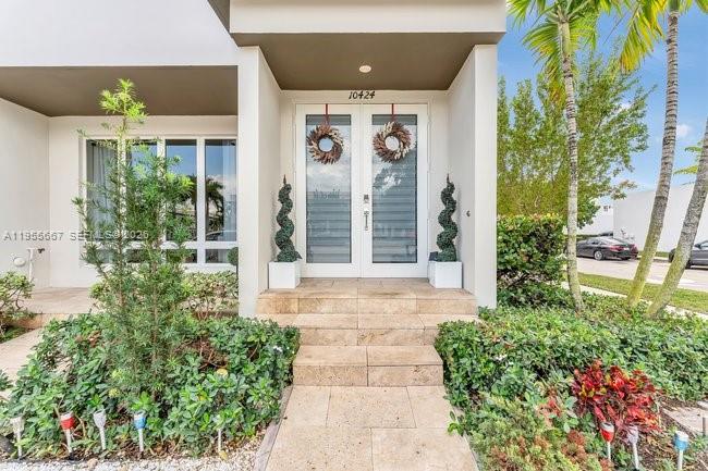Incredible opportunity to live in style! Luxurious two-story 4/3.5 Corner Townhome in the vibrant City of Doral and within the Landmark community that offers Resort Style clubhouse, luxury pool, tennis court, picnic areas, fitness center, Business center, Hot tub, Sauna, Playground.  This stunning home has an ideal design with spacious living area, dining room, open kitchen, family room, patio, 2-car garage plus next gen with separate entrance (One suite over the garage, great for an extra income or in-laws). Impact resistant windows, glass doors and steel garage doors.  Conveniently located near Downtown Doral, top-rated schools, restaurants, shopping, MIA, easy access to major highways.  Don't wait more! Impact resistant windows, glass doors and steel garage doors.  Conveniently located near Downtown Doral, top-rated schools, restaurants, shopping, MIA, easy access to major highways.  (Exterior painted January 2026)