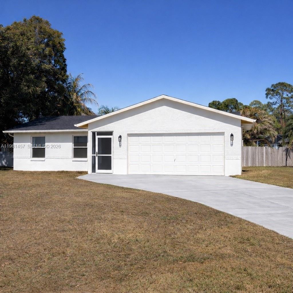 Incredible opportunity to own this charming 2 bedroom, 2 bathroom home on a spacious corner lot located in the heart of Port St. Lucie.  This pristine property was recently renovated with porcelain tiles throughout and updated master bathroom. An open kitchen, adjacent to a large dining room, with a new refrigerator and garbage disposal, recently installed.  A split bedroom layout with spacious walk-in closets and plenty of storage room.  The fencing was just replaced along with a new flat roof.  It features an oversized covered patio with a pass through bar top, giving you that great feeling for relaxation and entertaining your family and friends.