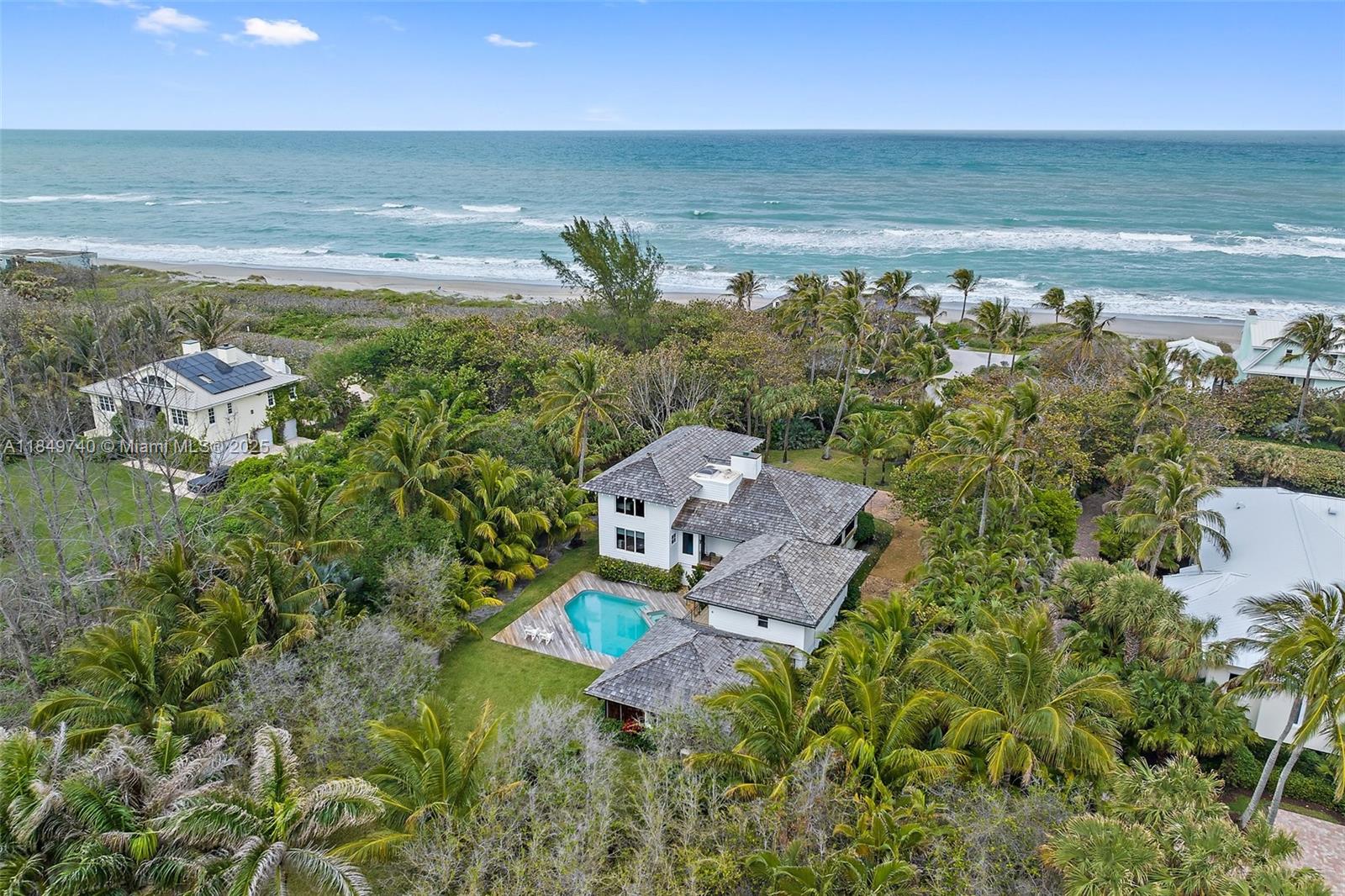 JUPITER ISLAND SPECIAL!! Beautiful and unique architects own home, sitting on a wonderful private lot at the North end of the island. Just steps to the gorgeous beach (about 200') without paying oceanfront prices.
Ocean views from primary bedroom, 2 story coral stone fireplace, Cypress ceilings, hardwood floors throughout.