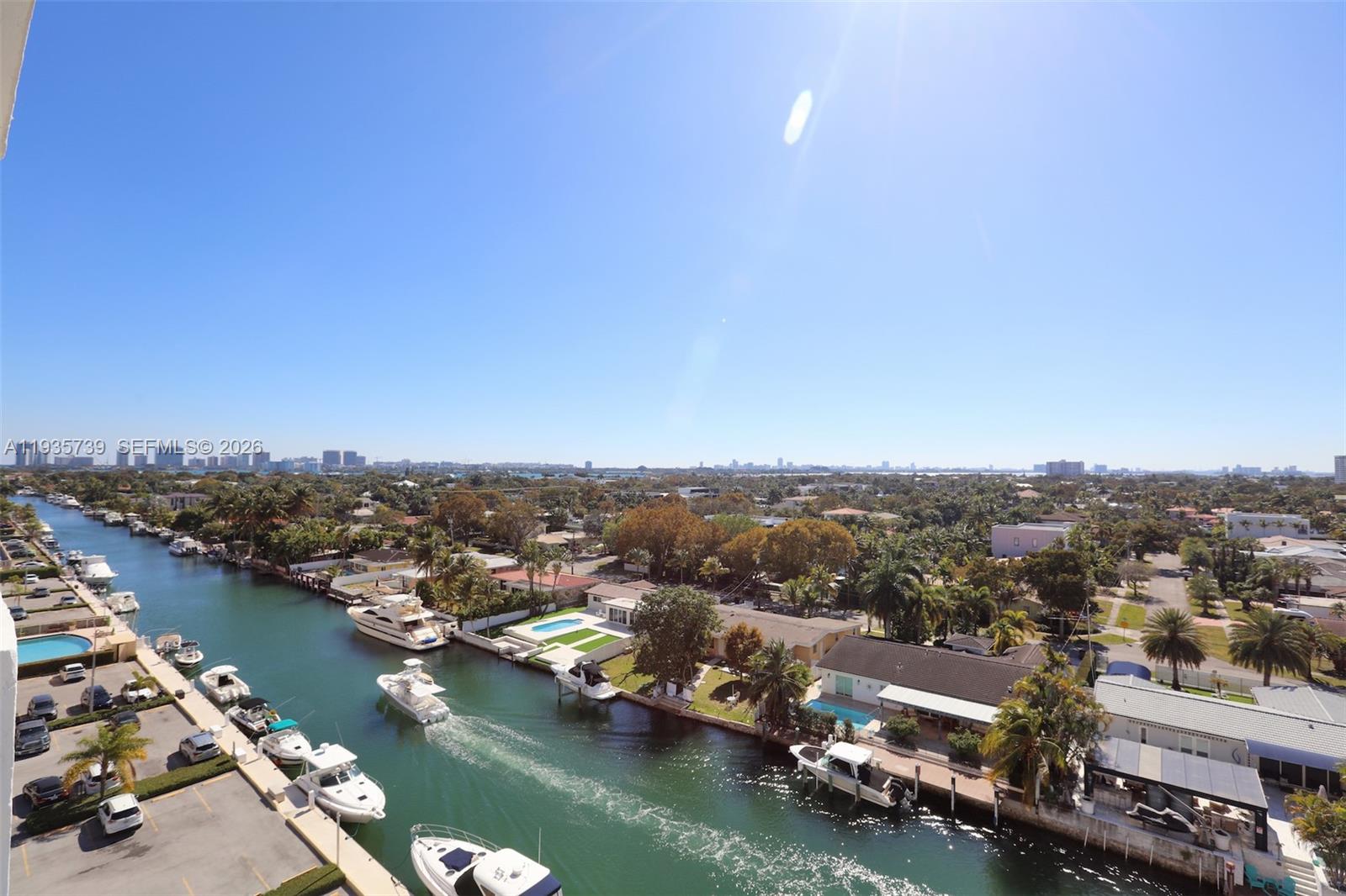 Gorgeous water view, modern fully remodeled apartment featuring light oakwood vinyl floors, modern kitchen cabinets with quartz countertops and backsplash, fingerprint resistant stainless steel appliances, a separate vanity area with a floating vanity and round backlit mirror, floor to ceiling custom closets with floating shelves and drawers, and much more. Enjoy the best view in the building from your private balcony overlooking the canal and the intersection with another canal, creating an open and stunning water view. Located close to universities and a park at the end of the street, and just 10 minutes from Bal Harbour Shops and the beaches. Excellent opportunity for investors, generating over 5% annual return, with a new building being constructed nearby that is expected to add value to the surrounding properties. Tenant occupied until February 26, 2026.
