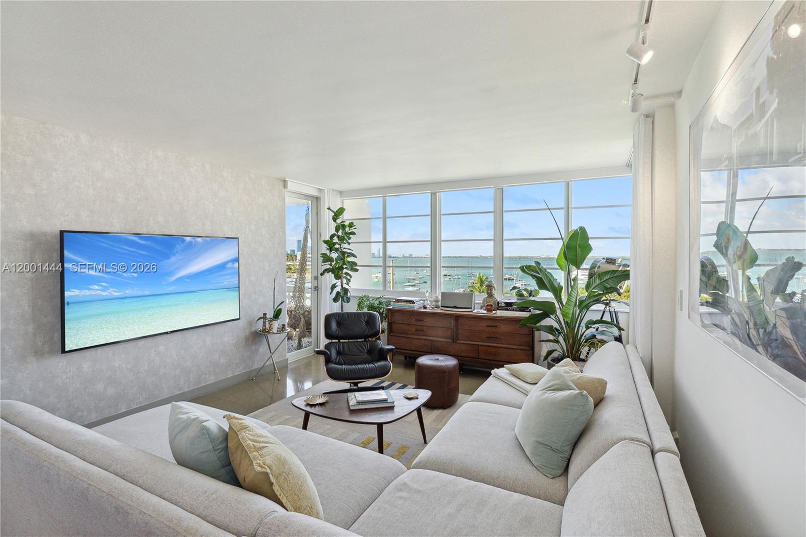 Experience elevated waterfront living in this stunning top-floor 1-bedroom, 1-bathroom designer residence spanning 757 SF in an exclusive boutique building. With an assumable with qualifying mortgage at 2.75%, this exceptional offering combines style, value, and breathtaking bay views. Floor to ceiling natural light enhances the modern interior, where refined finishes, an open layout, and a sleek gourmet kitchen create an inviting and sophisticated atmosphere. The spacious bedroom and spa-inspired bathroom complete the home’s luxurious appeal. Perfectly situated across from Sunset Harbour Shoppes, this residence offers a peaceful waterfront setting just moments from premier dining, shopping, and the best of Miami Beach living. Monthly HOA includes reserves. Currently rented until 30 June, 2027 with 90 day kickout clause.