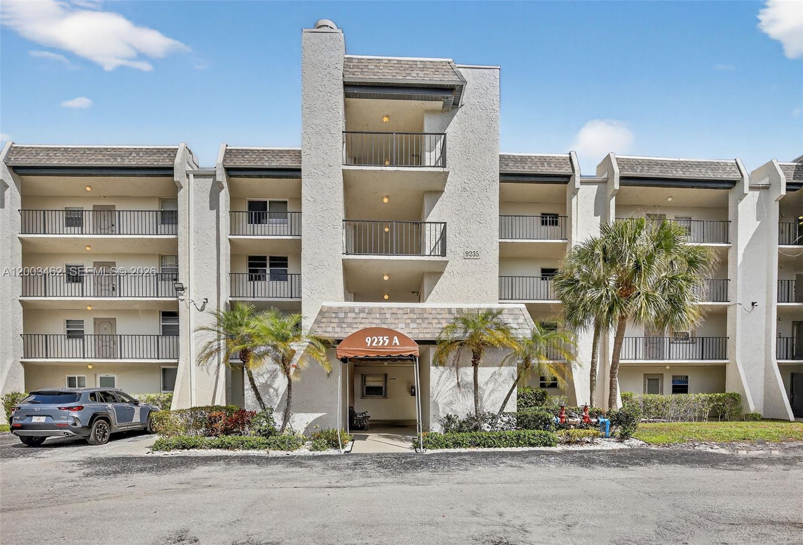 HUGE PRICE REDUCTION  What a magnificent view!!! Lovely condo with upgraded kitchen and stainless steel appliances. Enjoy the Florida sunshine on your screened patio with long lake view. Freshly painted and has new carpet in the bedrooms. Accordion hurricane shutters on all windows. Laundry room and storage room are right across the hall. Food and beverage card for restaurants at Pine Island Ridge Golf and Country Club - $175 annual. Lovely pool area and garden setting. Complex has a new roof 2023.