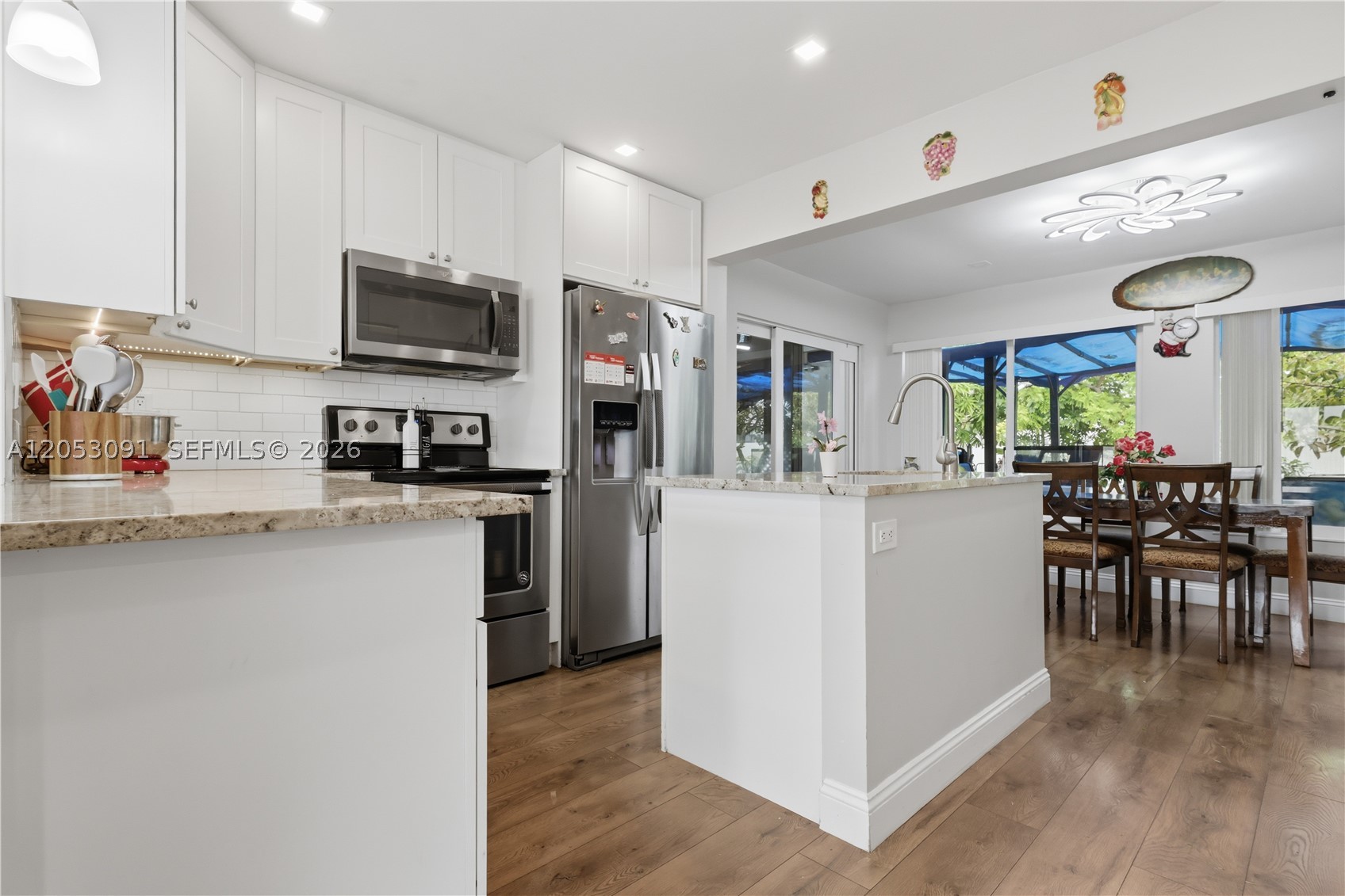 SELLER OFFERING A $3,000 CREDIT TOWARD BUYER'S CLOSING COSTS WITH AN ACCEPTABLE OFFER! Beautiful move-in ready 2-bedroom, 1-bath home with numerous upgrades located in the desirable 55+ Paradise Gardens community. Home features impact windows and a Sunrun solar energy system for added protection and energy efficiency. Roof, A/C system, and water heater are approximately 6 years old. Remodeled kitchen and bathroom with newer LG stainless steel washer and dryer. Enclosed sunroom and private backyard, perfect for relaxing or entertaining. Low HOA includes lawn maintenance, exterior house painting every five years, clubhouse, heated pool, and other community amenities. Perfect year-round residence or seasonal retreat. Don't miss this exceptional opportunity!