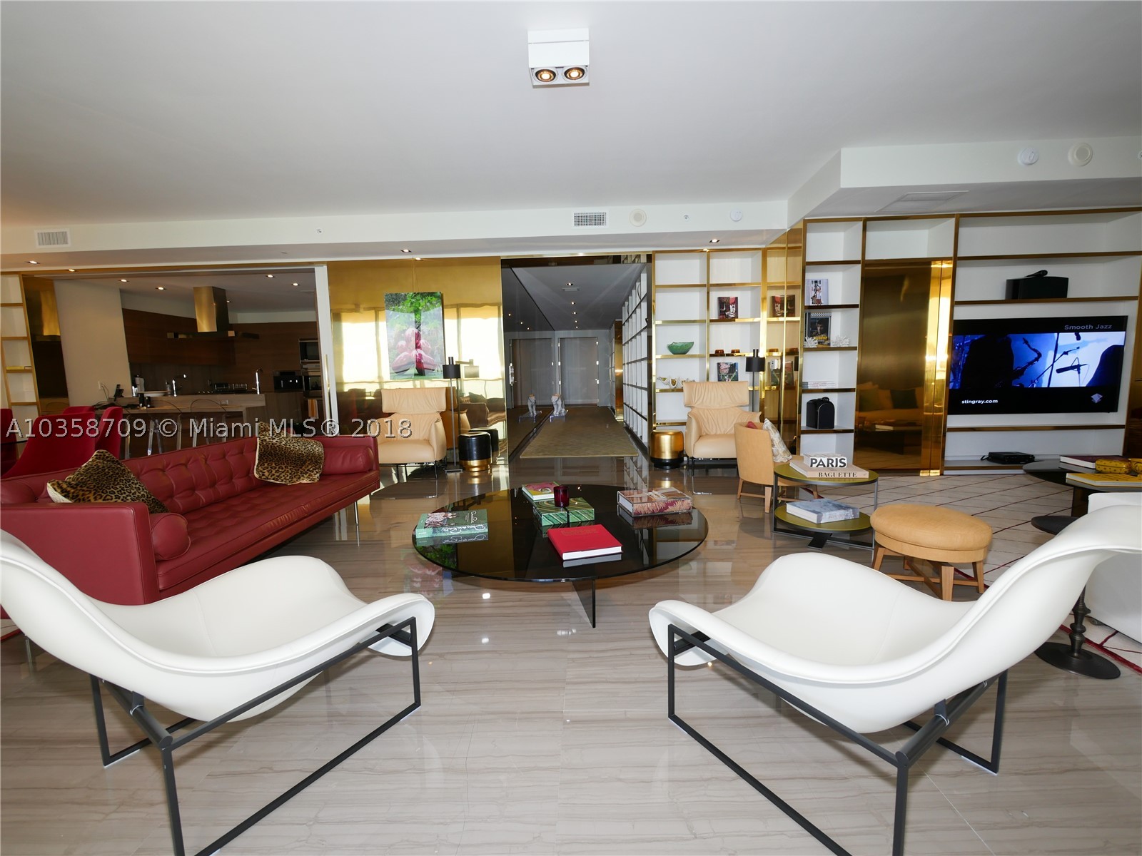 Back on the market and reduced again; owner motivated! This St. Regis Favorite is a True 4 Bedroom (plus a maids quarter- 5th bedroom) GEM directly across the famous Bal Harbour shops. The current and ONLY owner has tastefully modified the developer’s floorplan, maximizing living space (3,556 sqft under AC, 4801 total area), in a harmonic and elegant way. It was so well planned that even the kitchen can be temporarily closed off/isolated from the livingroom. Once you visit this masterpiece, you will understand the extent of the upgrades, not sparring any detail in finishes and décor.  Enjoy incredible sunrises from its 500 sqft terrace and breathtaking sunsets, bay, and city views from its other 700 sqft terrace on the 19th floor in the preferred South building.
